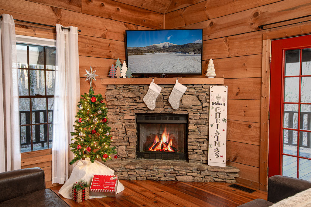 The festive living room with its stone fireplace.