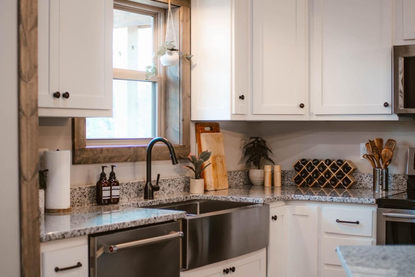 Farmhouse sink, spices, cutting boards, pots & pans, baking essentials for all you need to stay in and cook. 