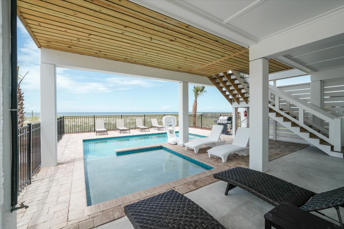 Ground level has a shallow pool for lounging or splashing and a pool that goes up to 5' deep.  The pool can be accessed directly from the middle floor or via stairs or elevator from anywhere in the house.