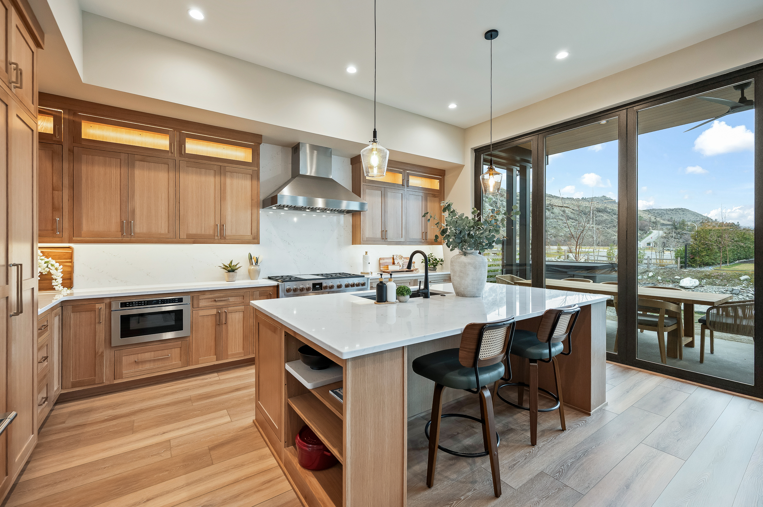 Dreamy chef's kitchen with custom cabinets, 6-burner gas stove, island seating, fully loaded with everything you need for your group. 