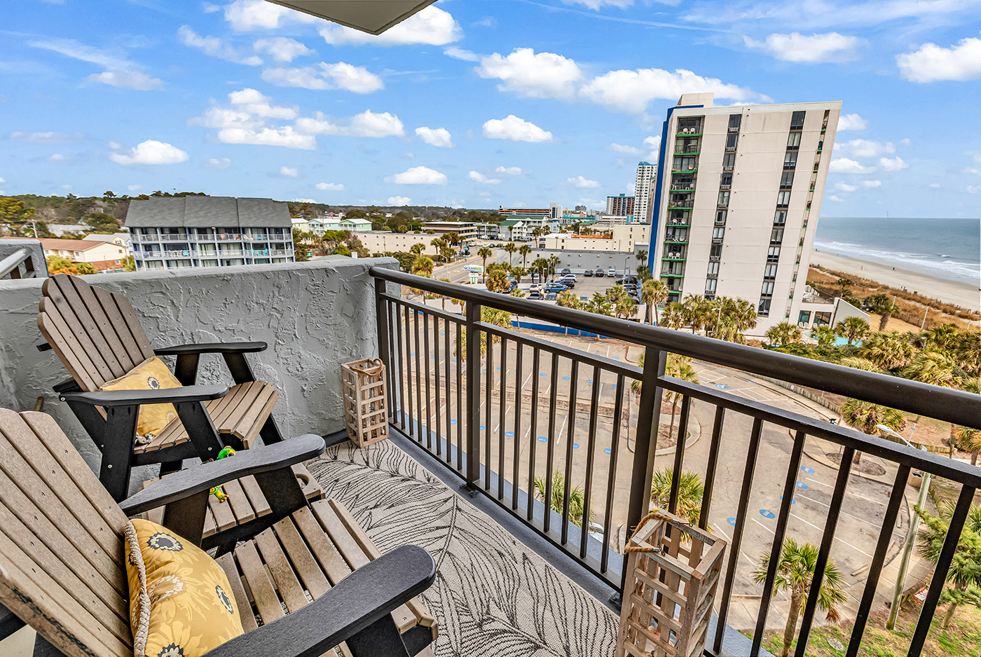Private balcony with Adirondack chairs and sweeping ocean views — perfect for morning coffee or evening sunsets