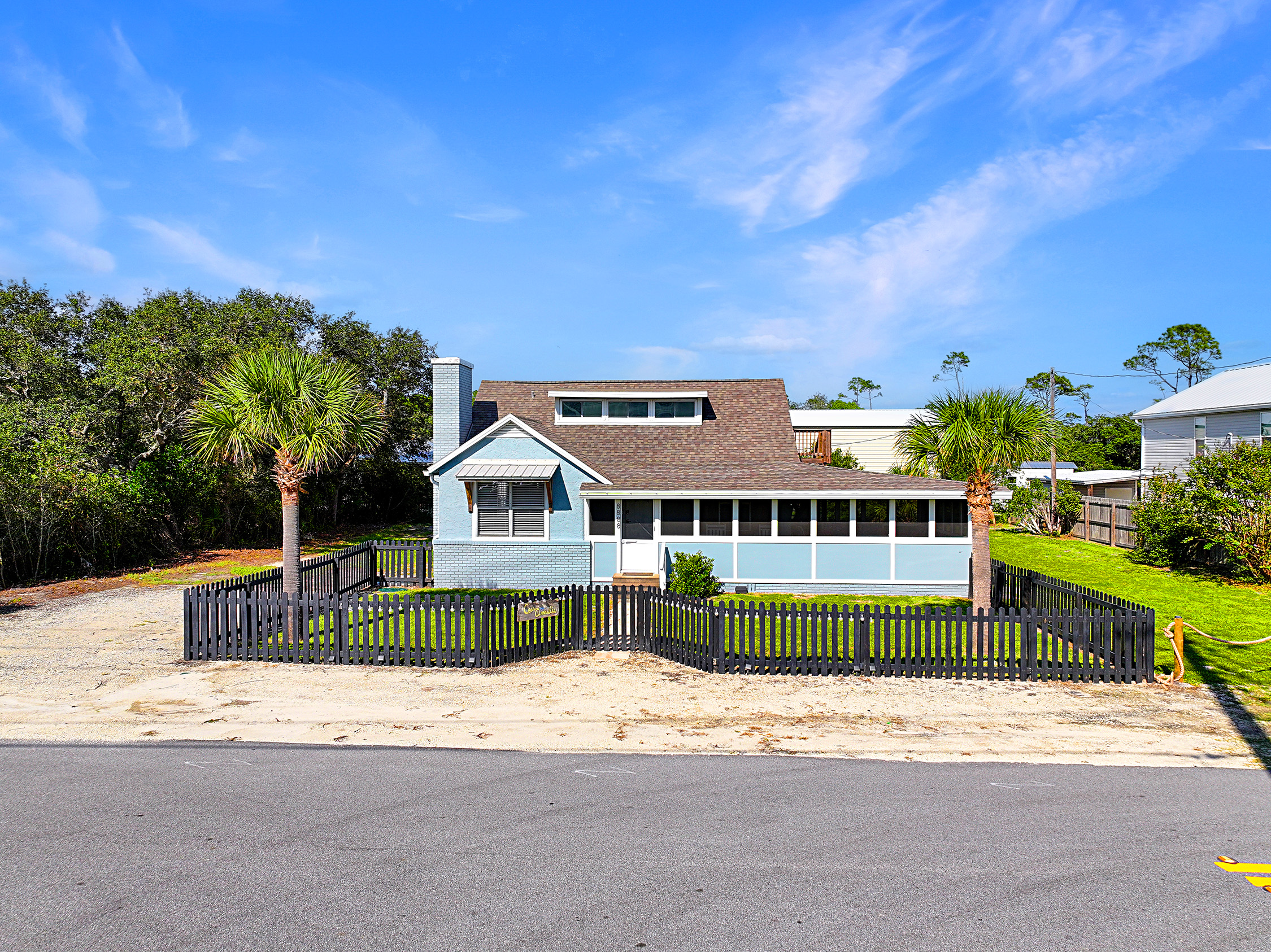 Fenced yard, plenty of parking, long screened in porch
