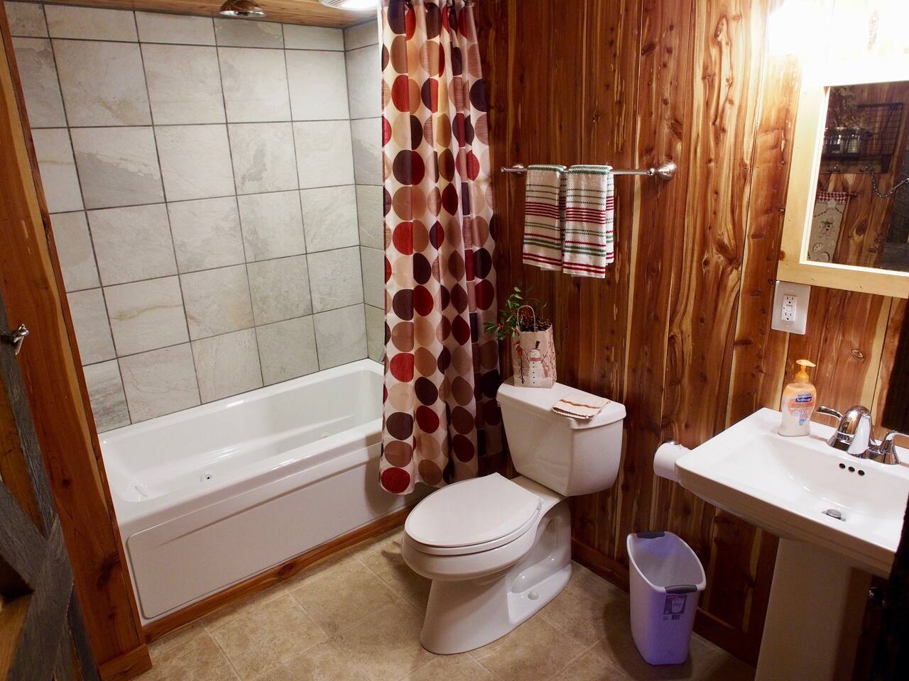 Well Appointed Bathroom with Jetted Tub and Rainforest Shower