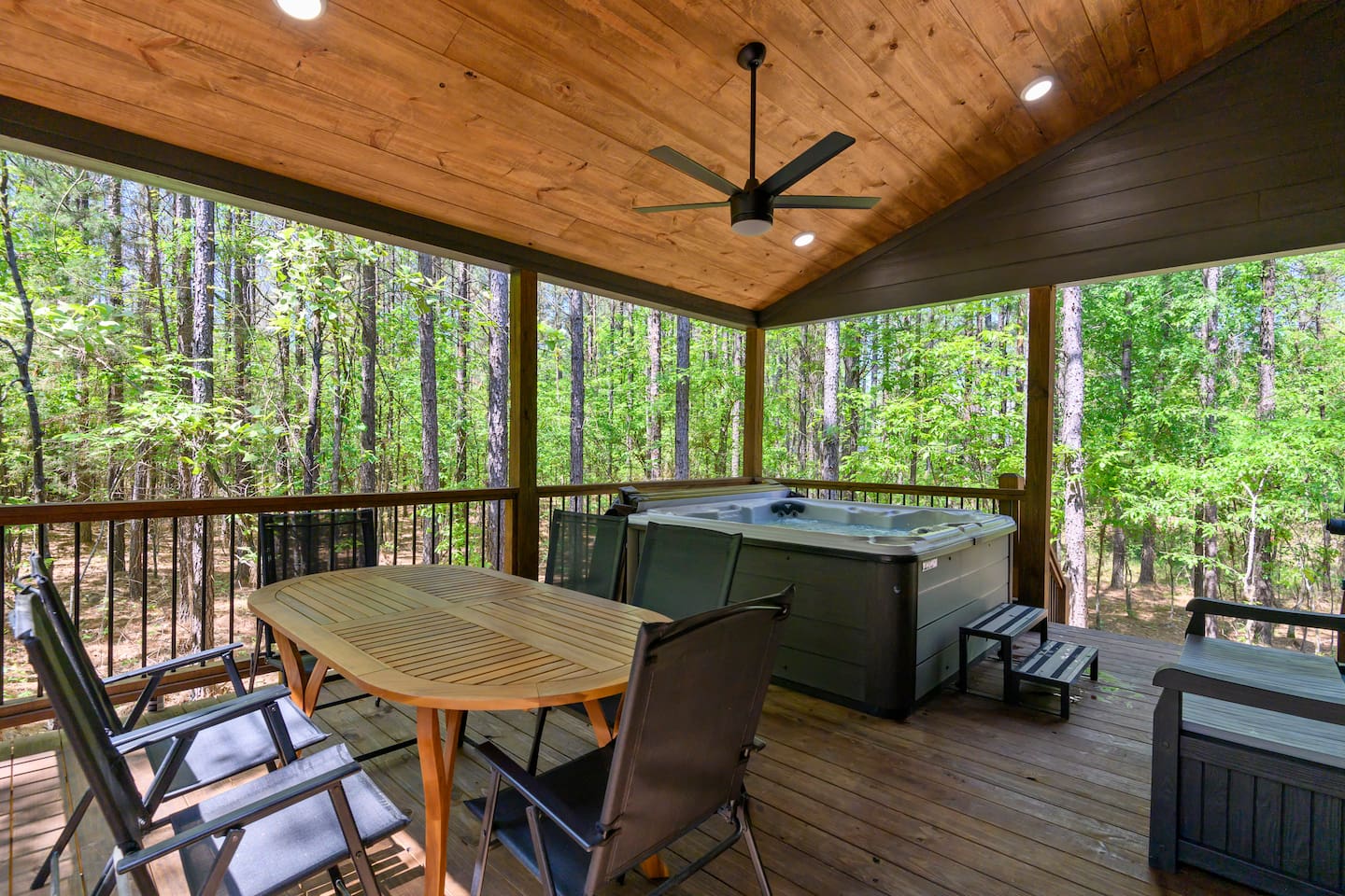 Dine under the trees just steps from the bubbling hot tub—nature pairs well with every meal.