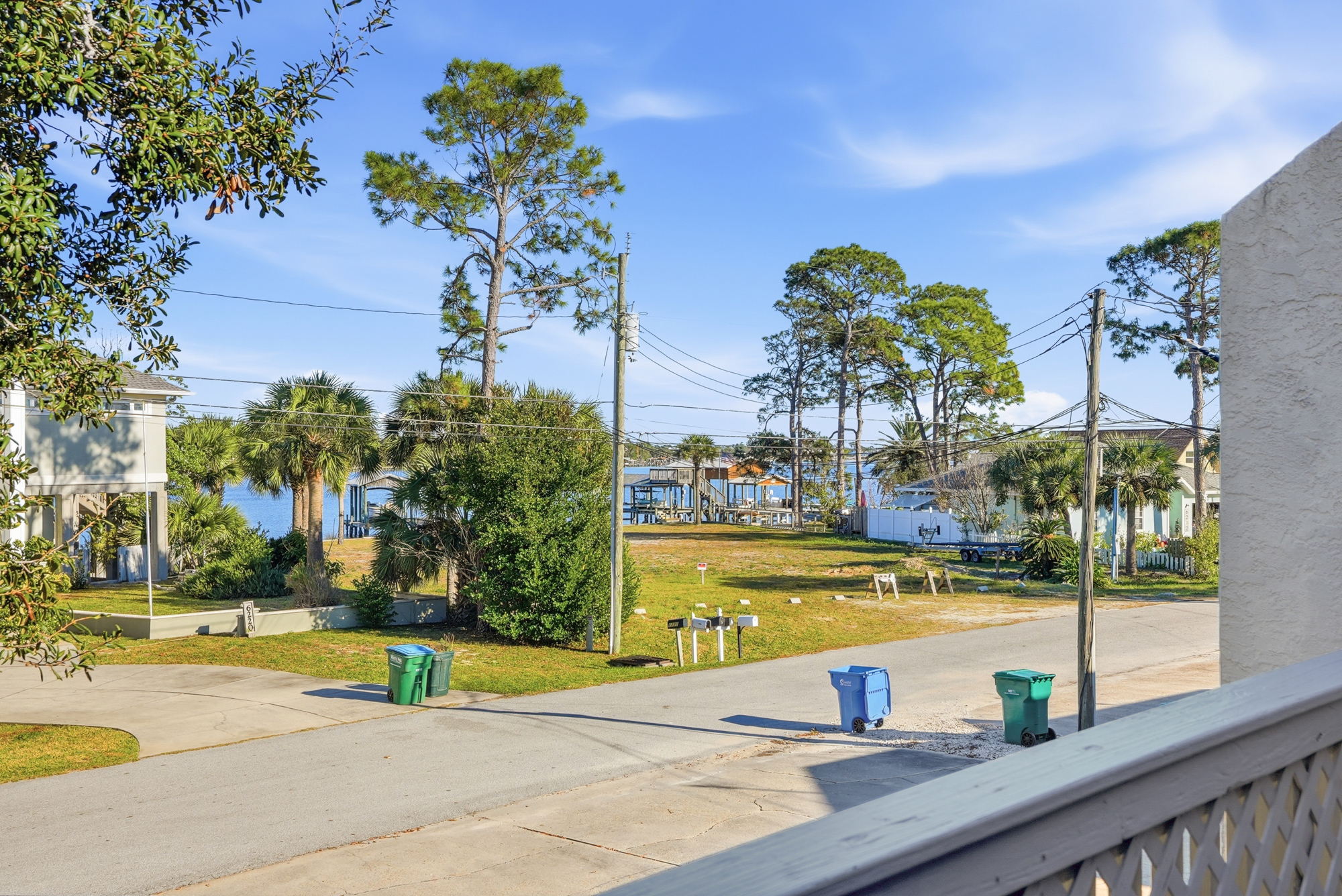 View From Front Balcony with Views of Grand Lagoon and Outdoor Seating