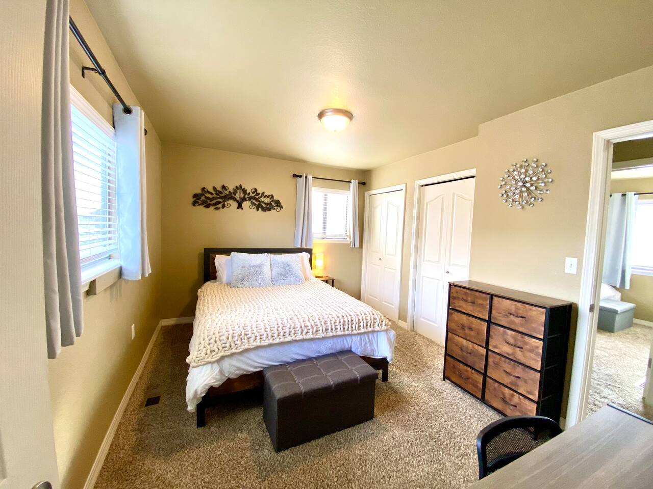 Master bedroom with desk and full bathroom