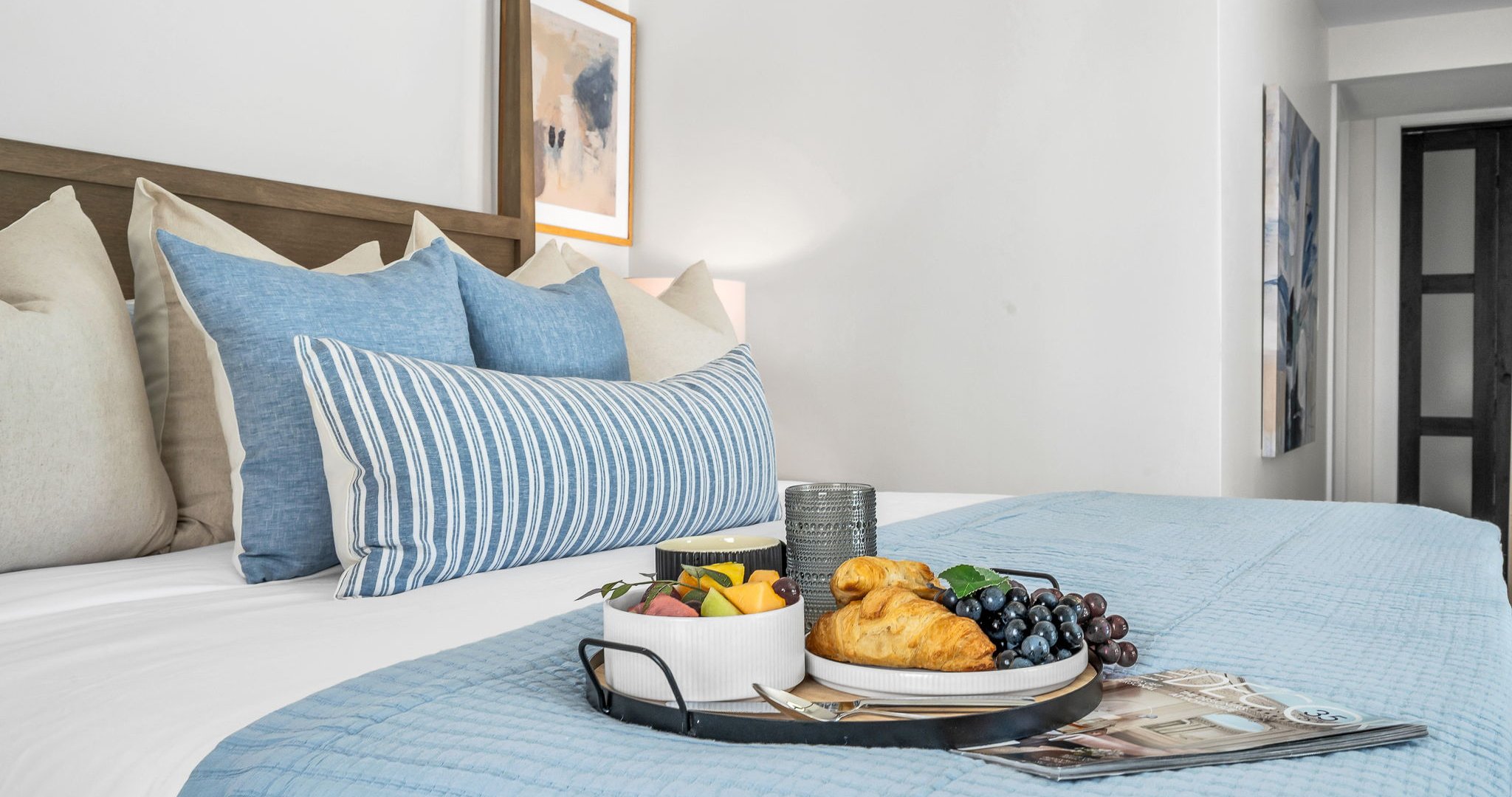 The primary king suite feels like your own private resort—featuring panoramic views of the pool and lake, seamless indoor-outdoor flow, and a newly renovated spa-inspired ensuite. Thoughtfully styled with designer finishes.