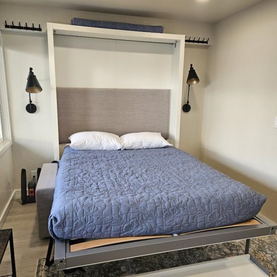 Pull down murphy bed/sofa: Full-size bed.