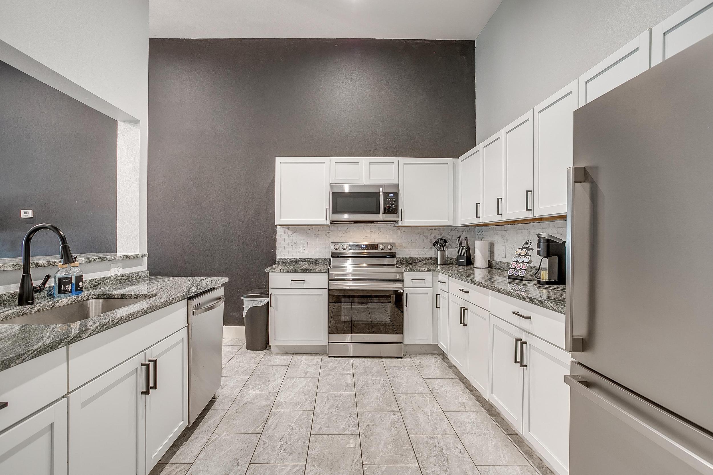 View from kitchen into the bright and stylish living space.