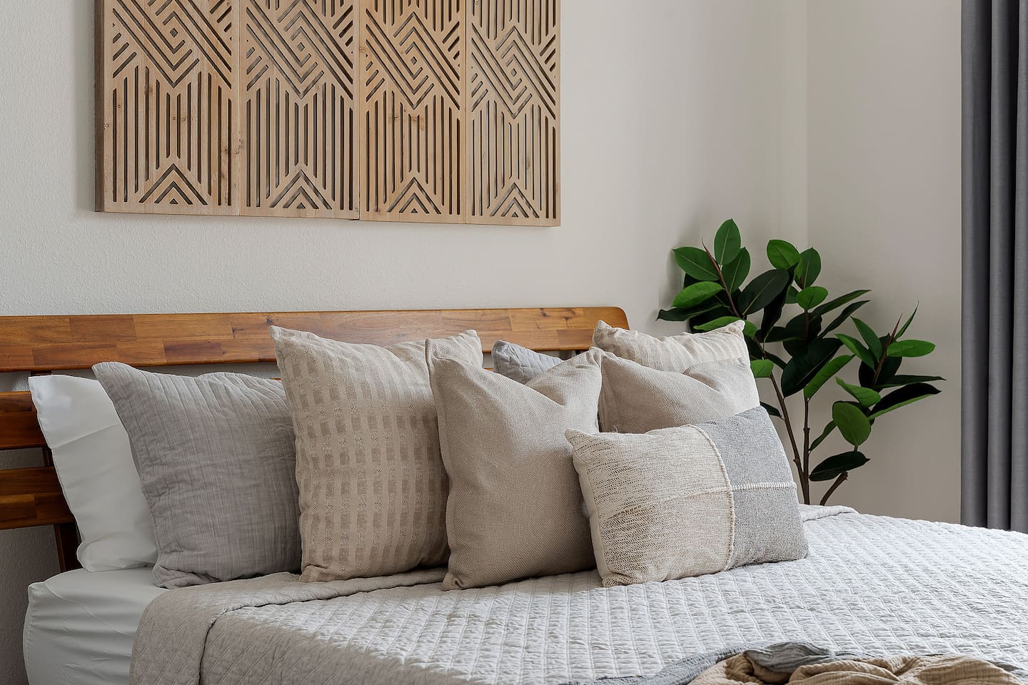 Embracing luxury and comfort in this spacious bedroom, where a king-size bed beckons amidst plush cushions. While glass window reveals a breathtaking view of the backyard pool area, creating a perfect blend of comfort and serenity.