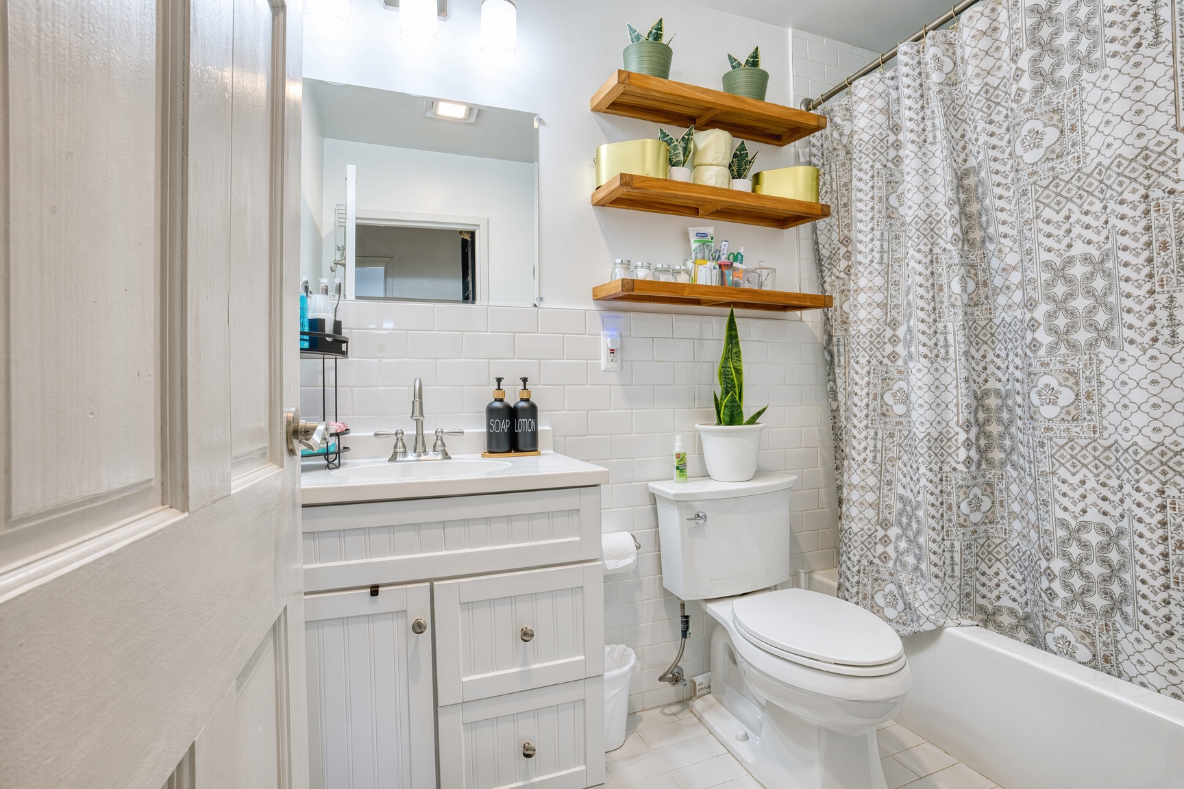 Full bathroom with wide range of supplies and toiletries. 
