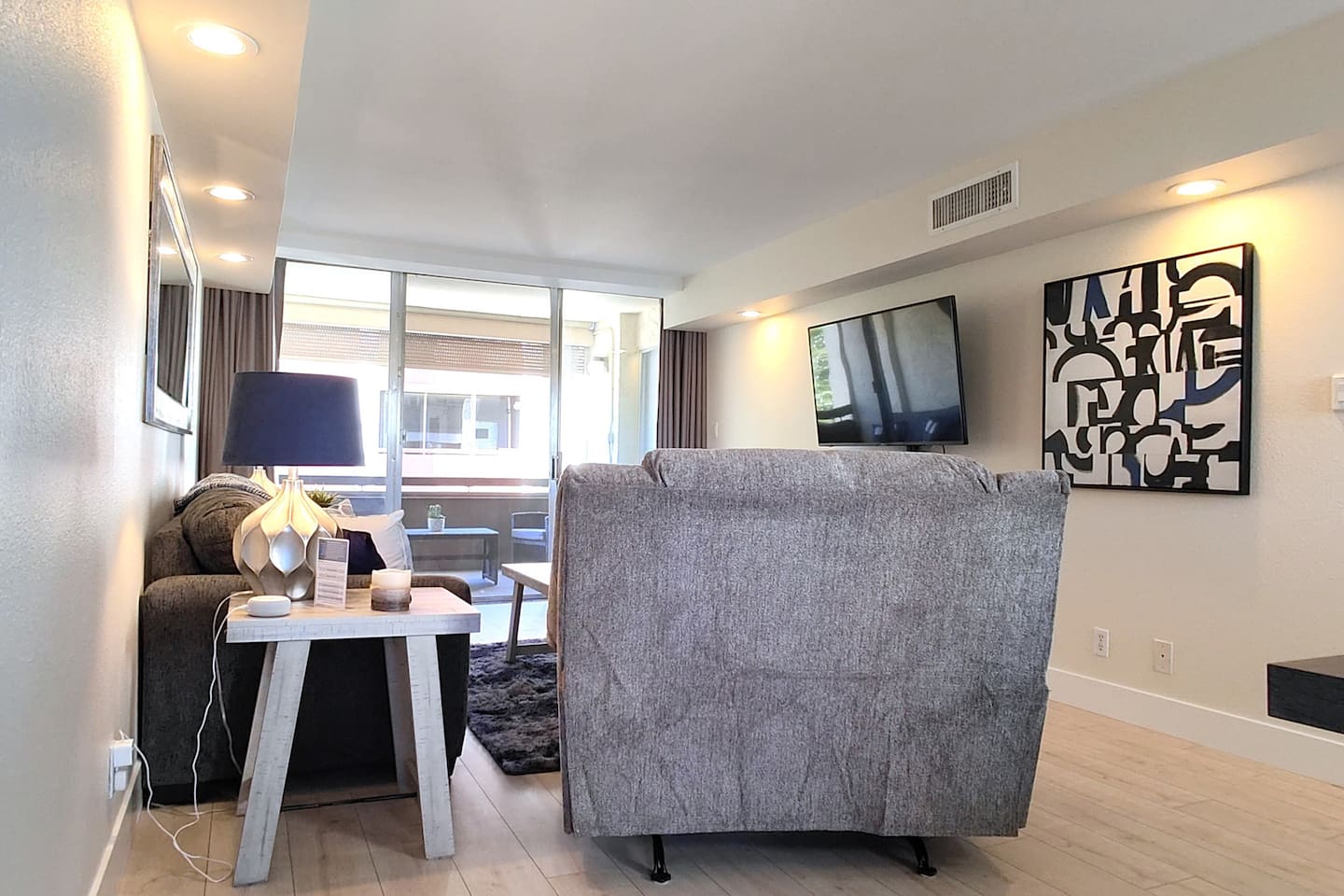 A myriad of entertainment options including a 55" 4k TV, Cox Contour Cable, and an Amazon Echo Dot with Alexa services. Open the balcony doors for true indoor/outdoor living.