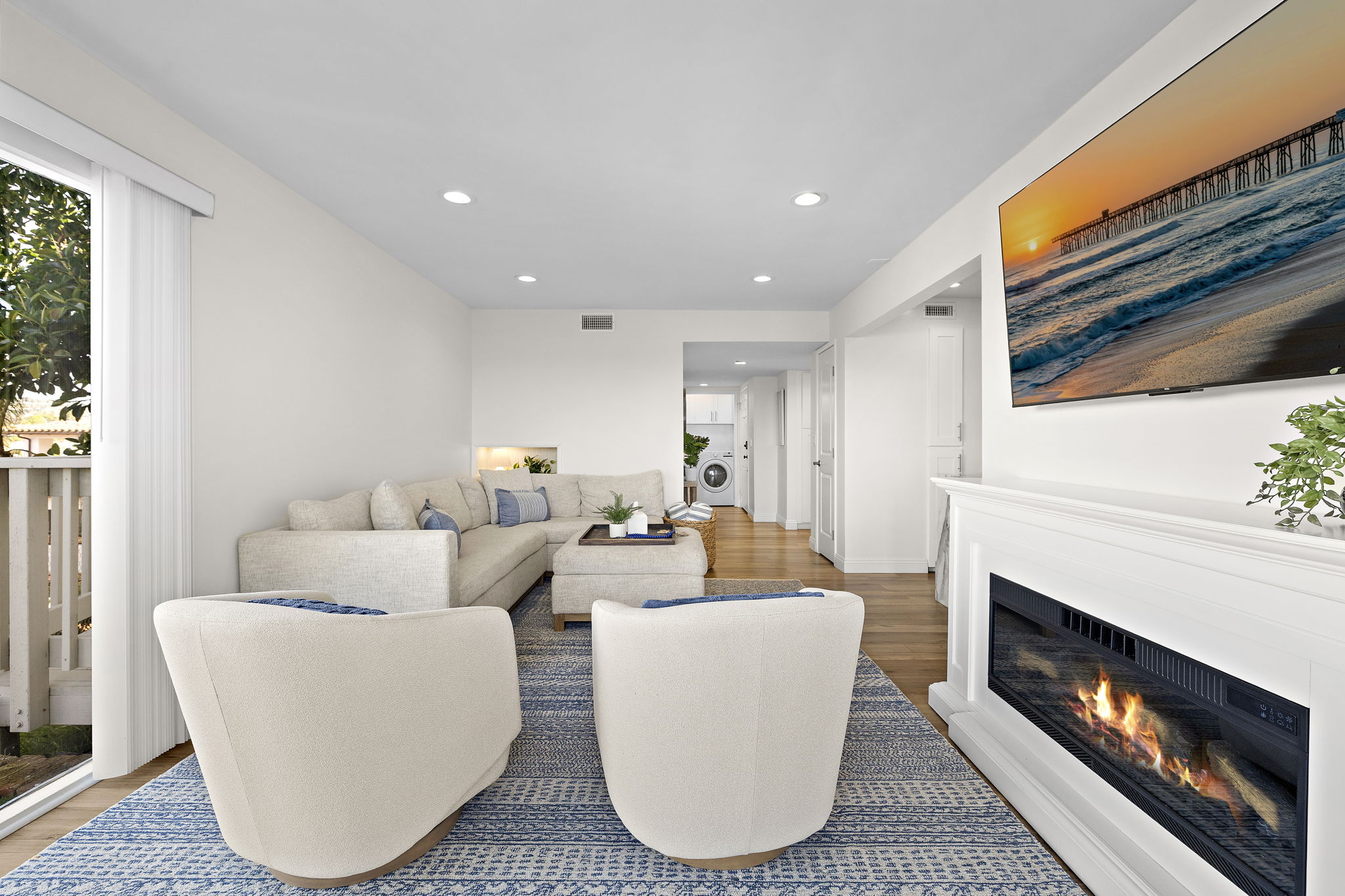 Cozy up by the fireplace or swivel to see the ocean and watch the sunset