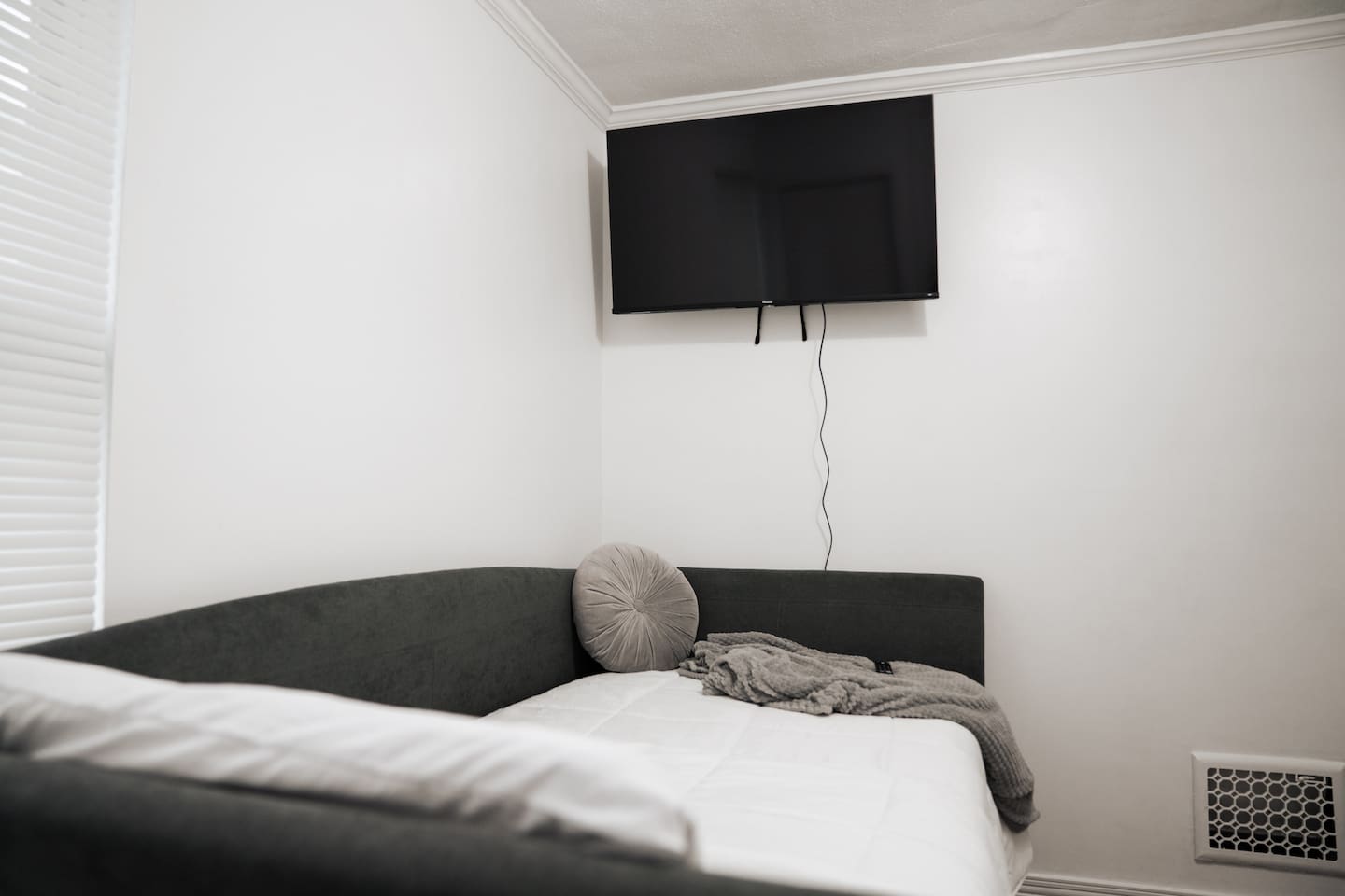 Day bed with Tv. Get comfy and read a book or watch your favorite show.