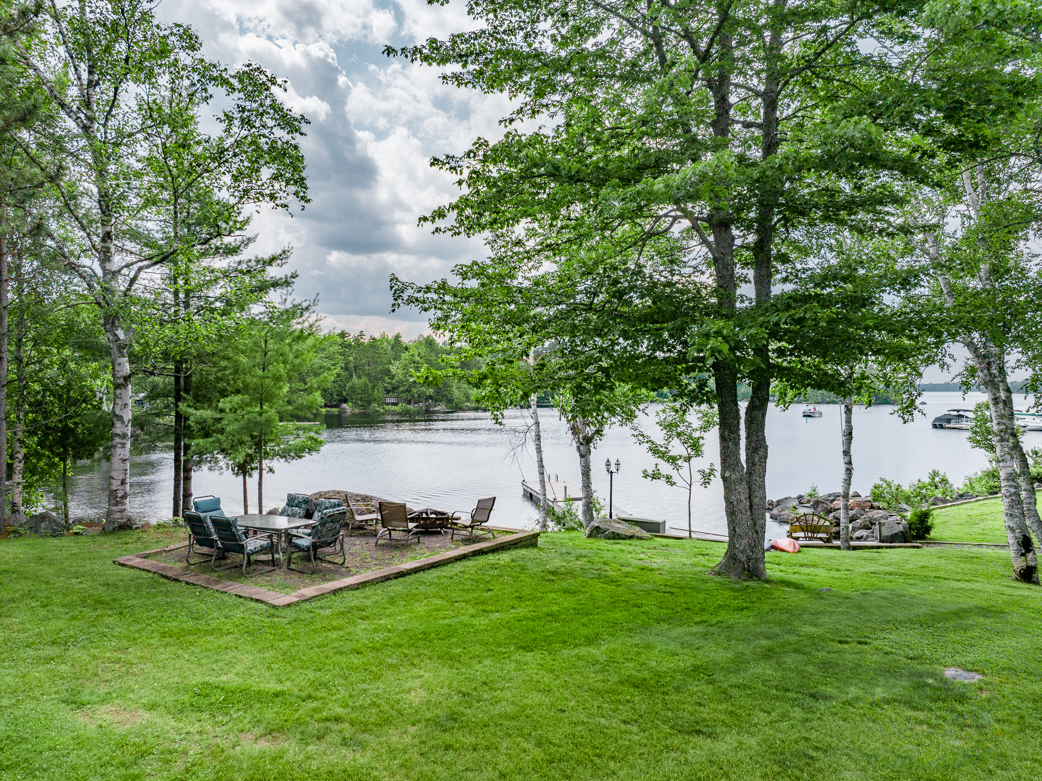 Seating area plus fire pit to enjoy a fire by the lake