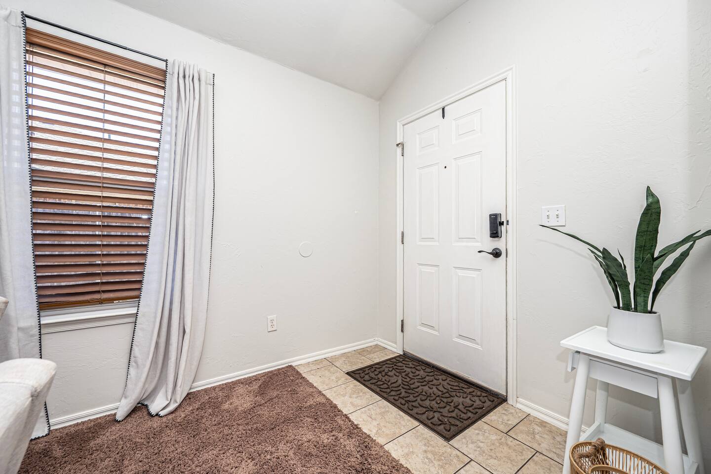 Inviting living room with smart TV, fireplace, and plenty of comfort.