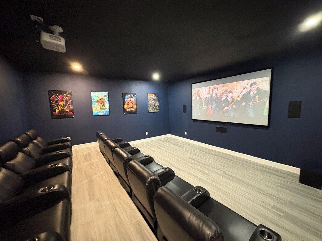 Premium theater with power reclining chairs & surround sound seats 12