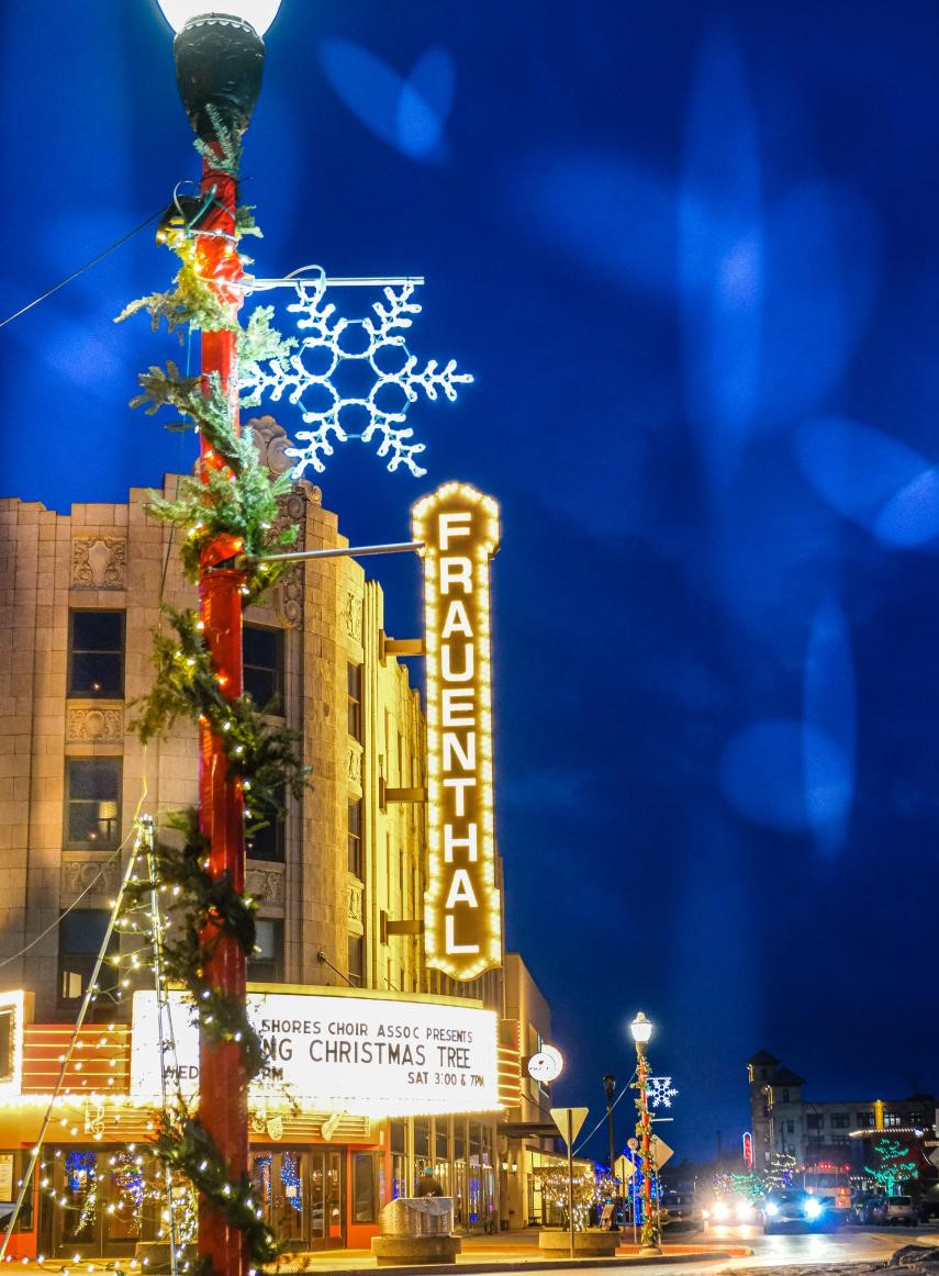 Stroll beneath the glowing lights of downtown Muskegon, where holiday charm fills the crisp winter air