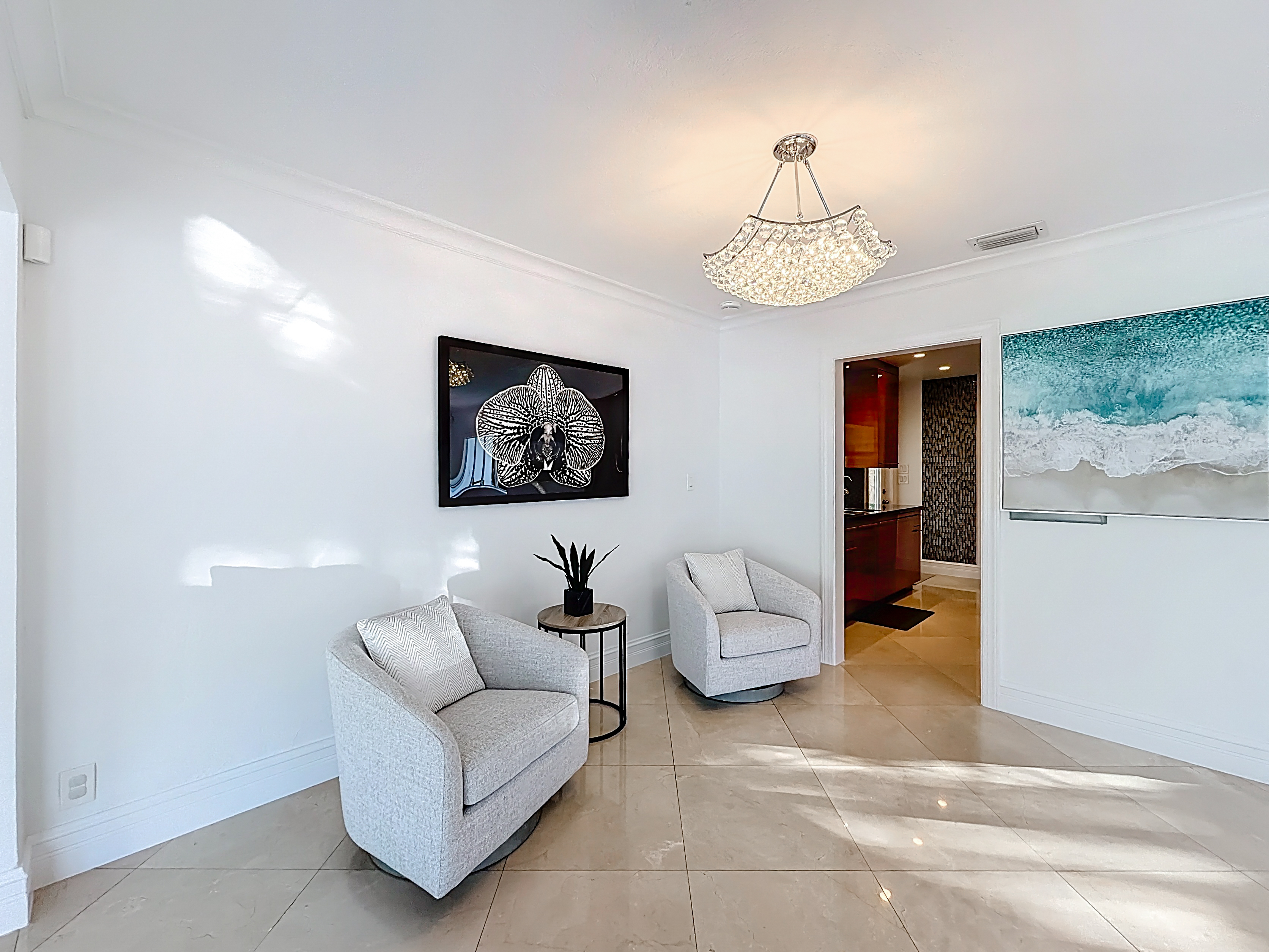 The swivel chairs are a popular sitting area, tying together the dining room, living room, and kitchen. 