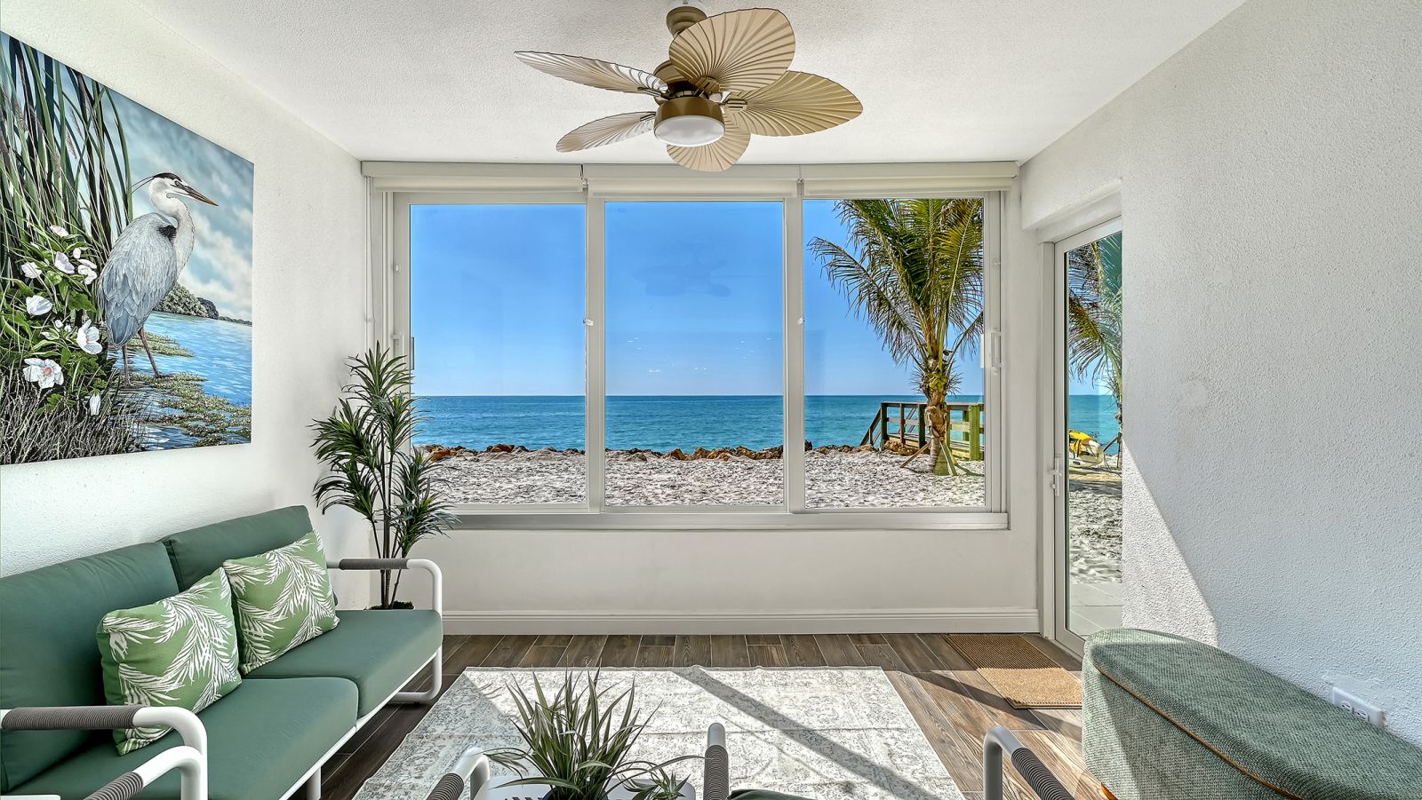 Lanai sliding windows and door to the beach. 