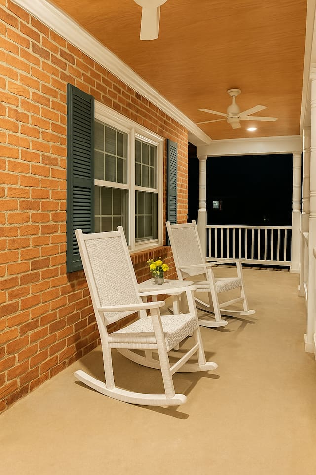 Relax on the front porch at dusk, where classic rocking chairs and warm lighting set the tone for a calm evening.   Smoking is allowed here 