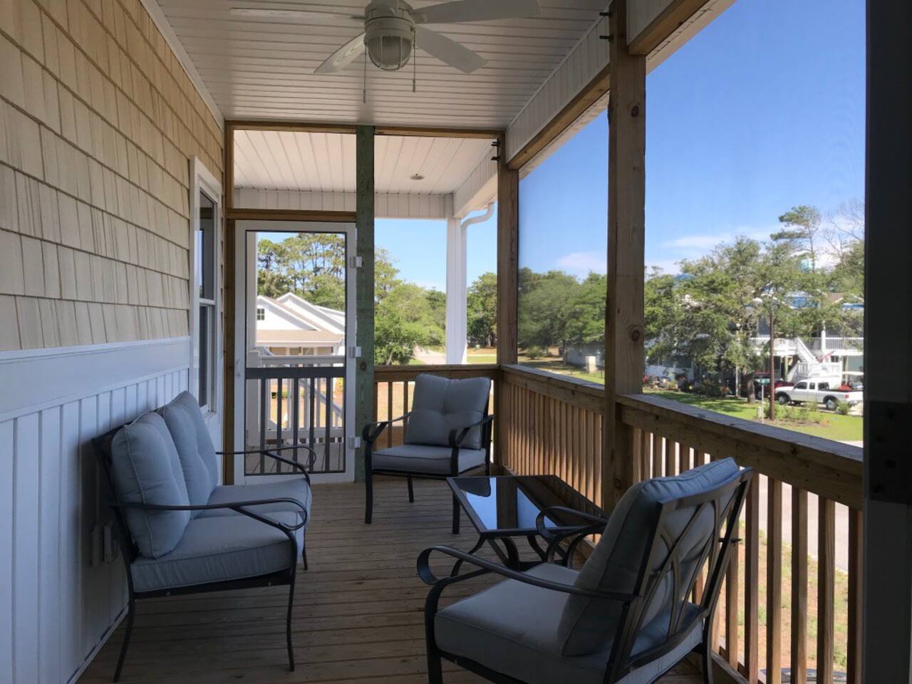 Enjoy ocean breeze and morning coffee from this screen porch