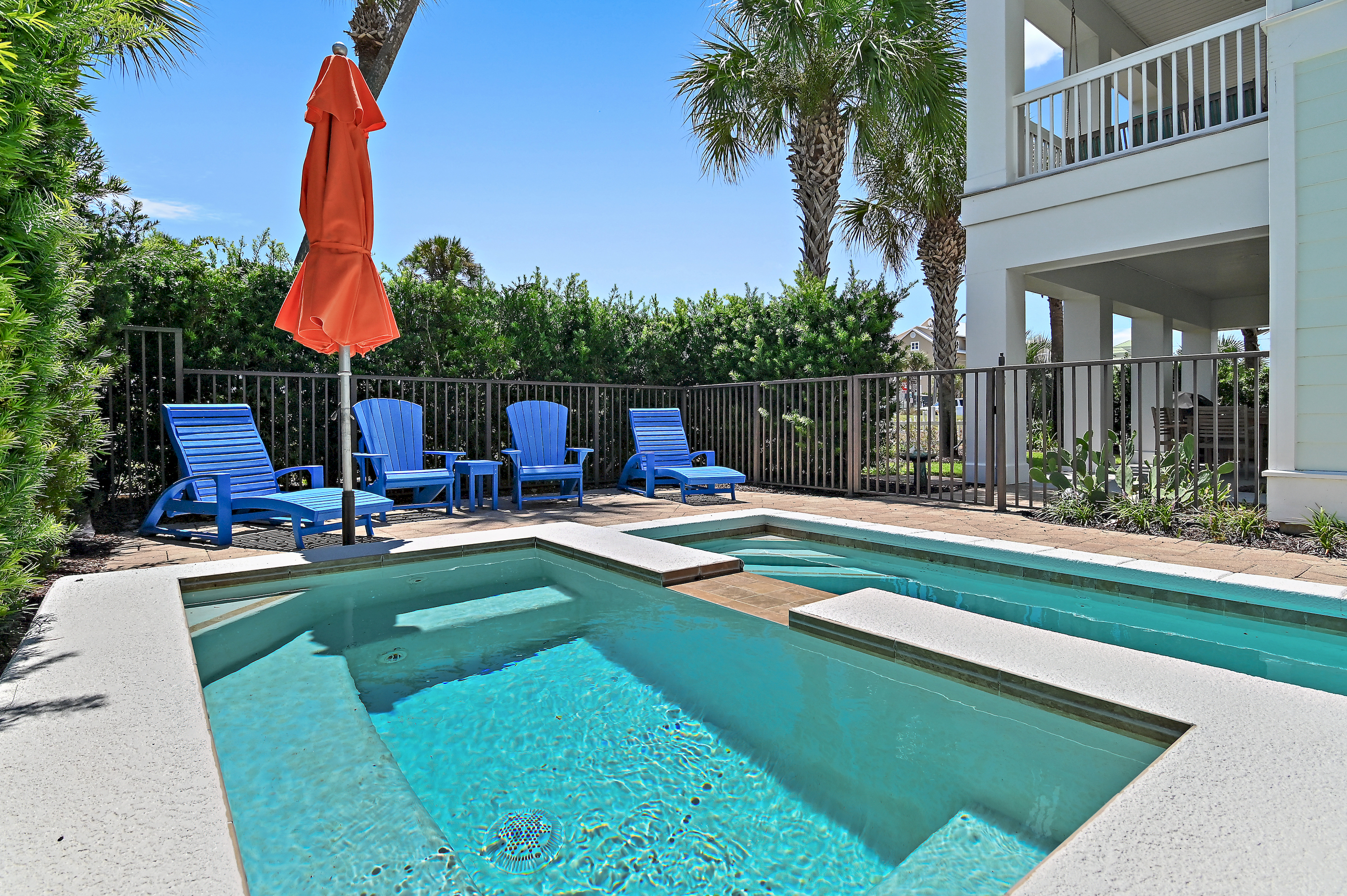 Enjoy sunny afternoons by the private pool and spa, surrounded by tropical palms and colorful coastal touches. The perfect place to relax, unwind, and make unforgettable 30A vacation memories.