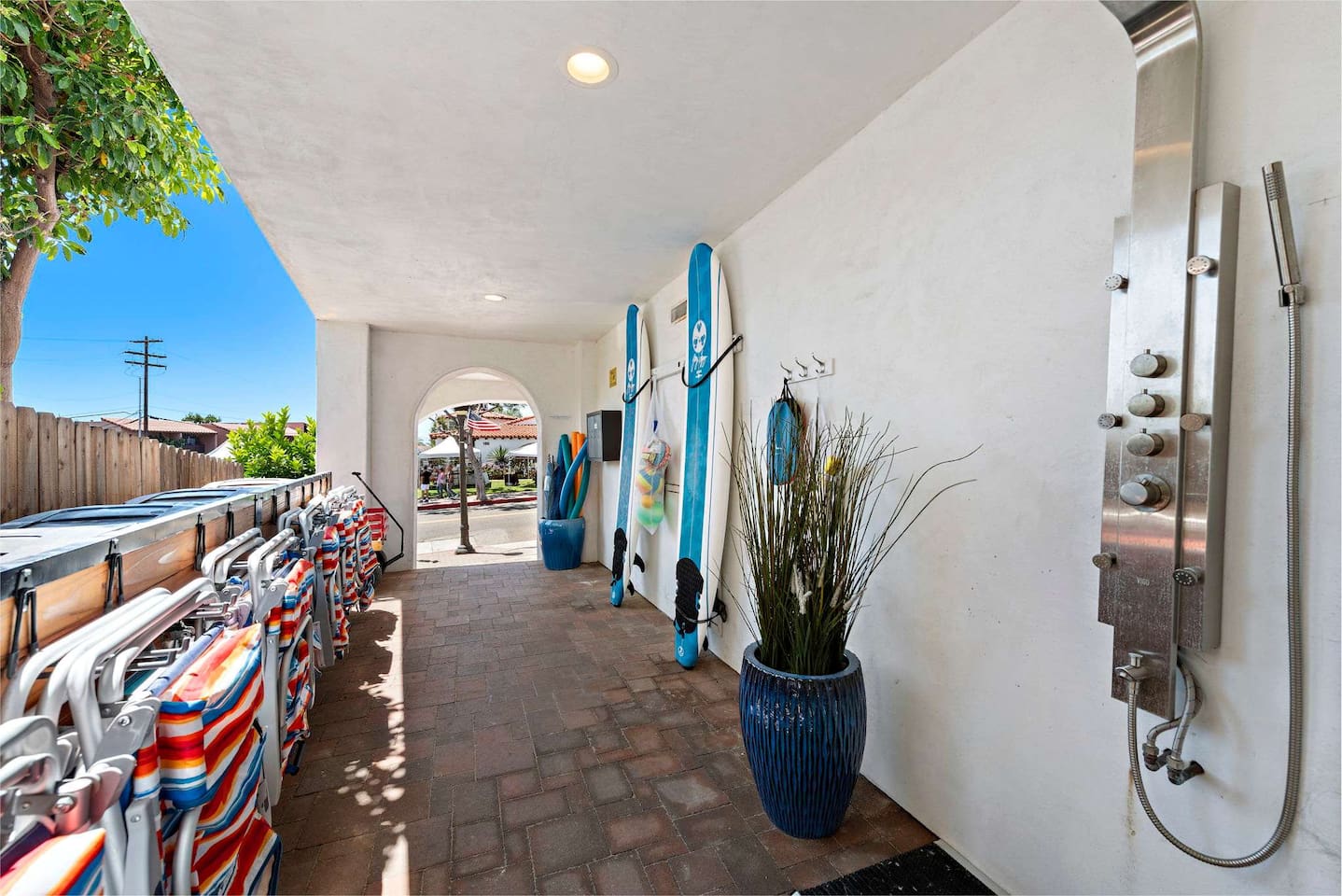 Our entryway feels like a resort.  We have beach chairs, boogie boards, foam surf boards and an outdoor shower.