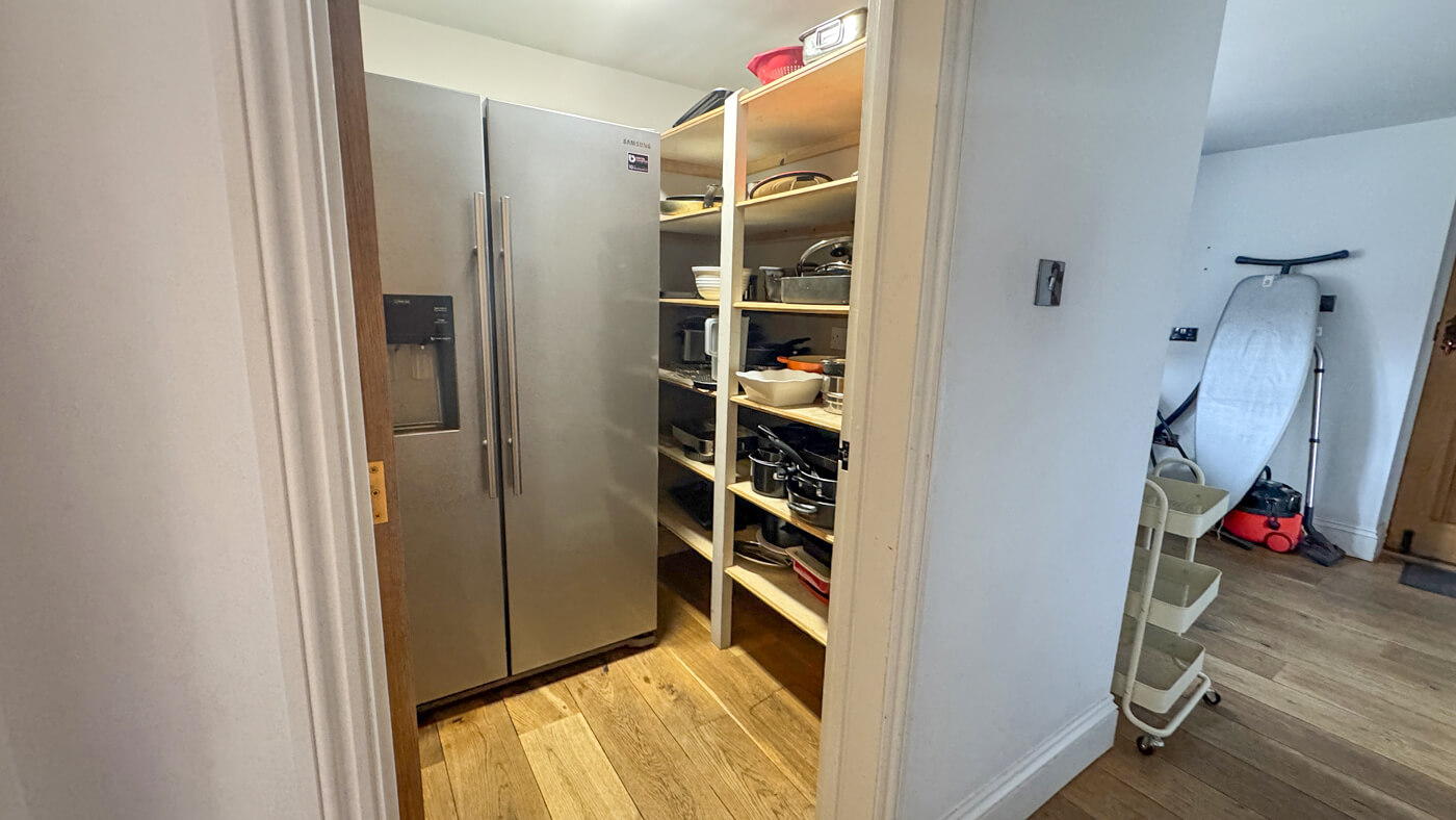 Utility pantry with fridge freezer