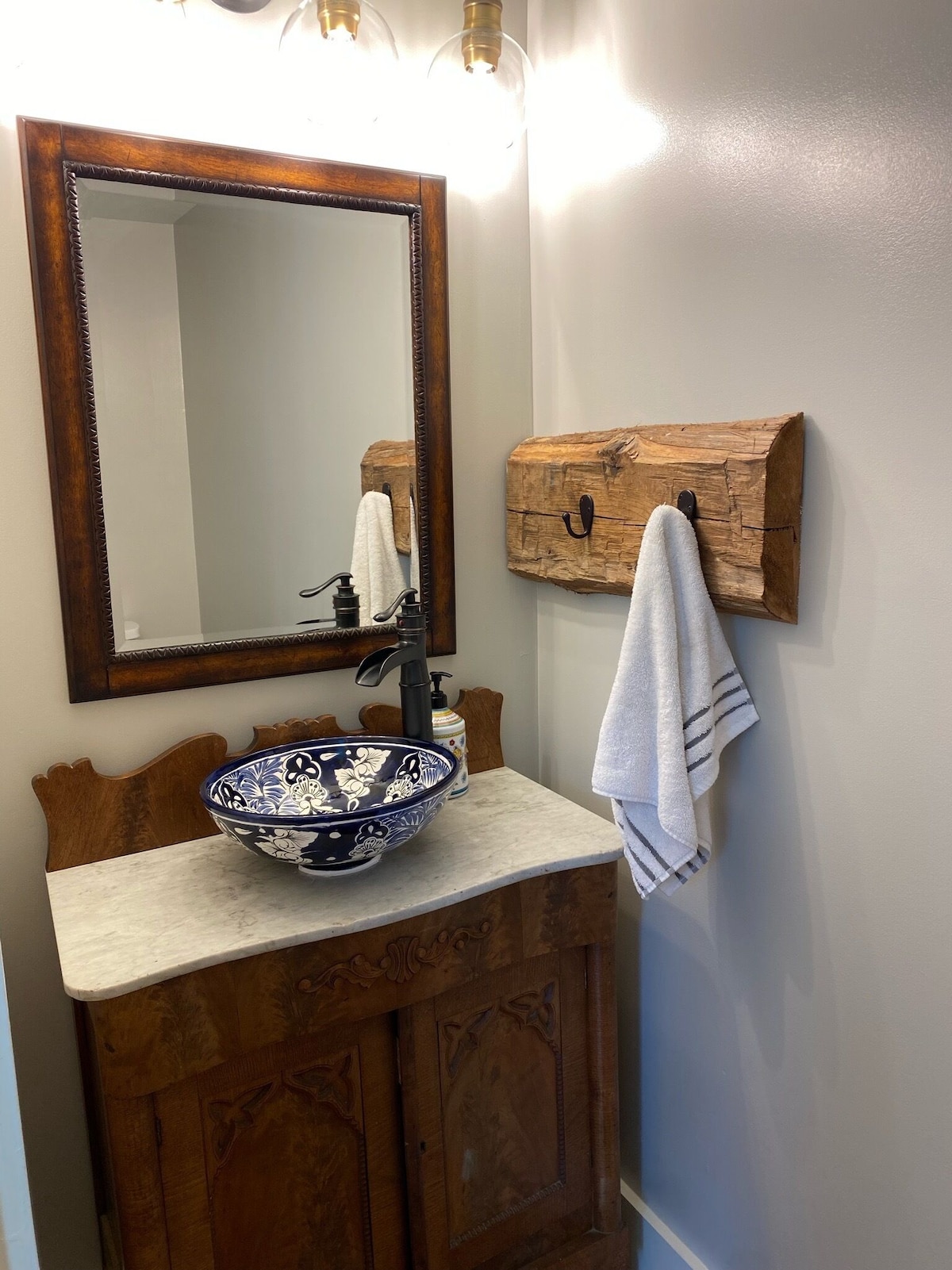 Half bath, talavera sink and antique dresser reconverted as vanity