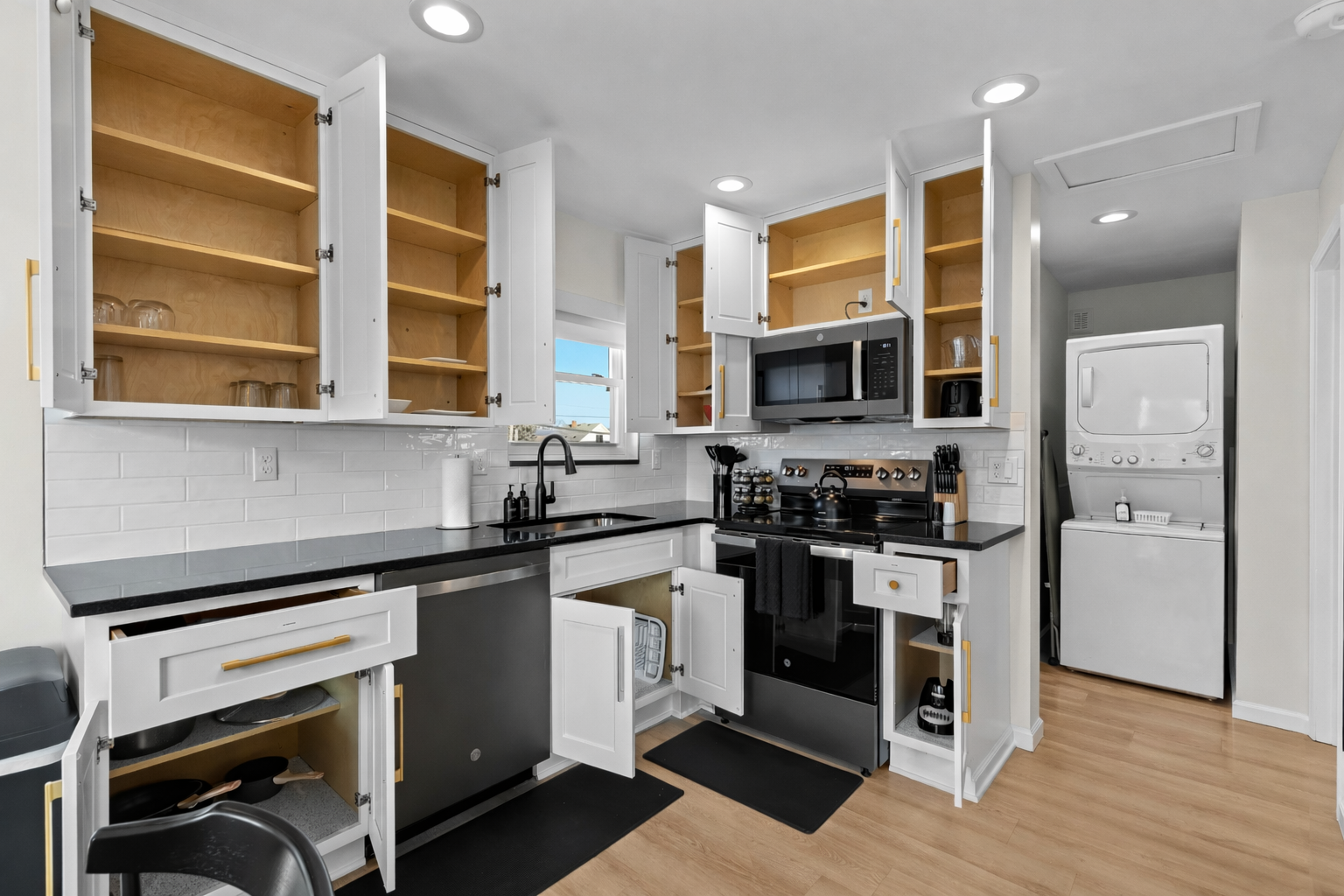 Modern, fully equipped kitchen with ample storage, sleek appliances, and clean finishes—perfect for cooking, meal prep, and easy everyday living.