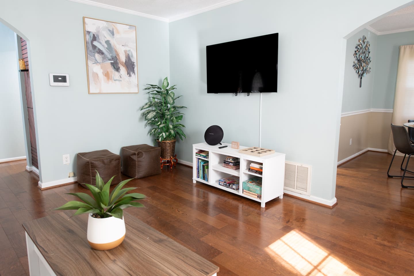 Game nights and movie marathons are easy with this bright, open space, flat-screen TV, and stocked game shelf.