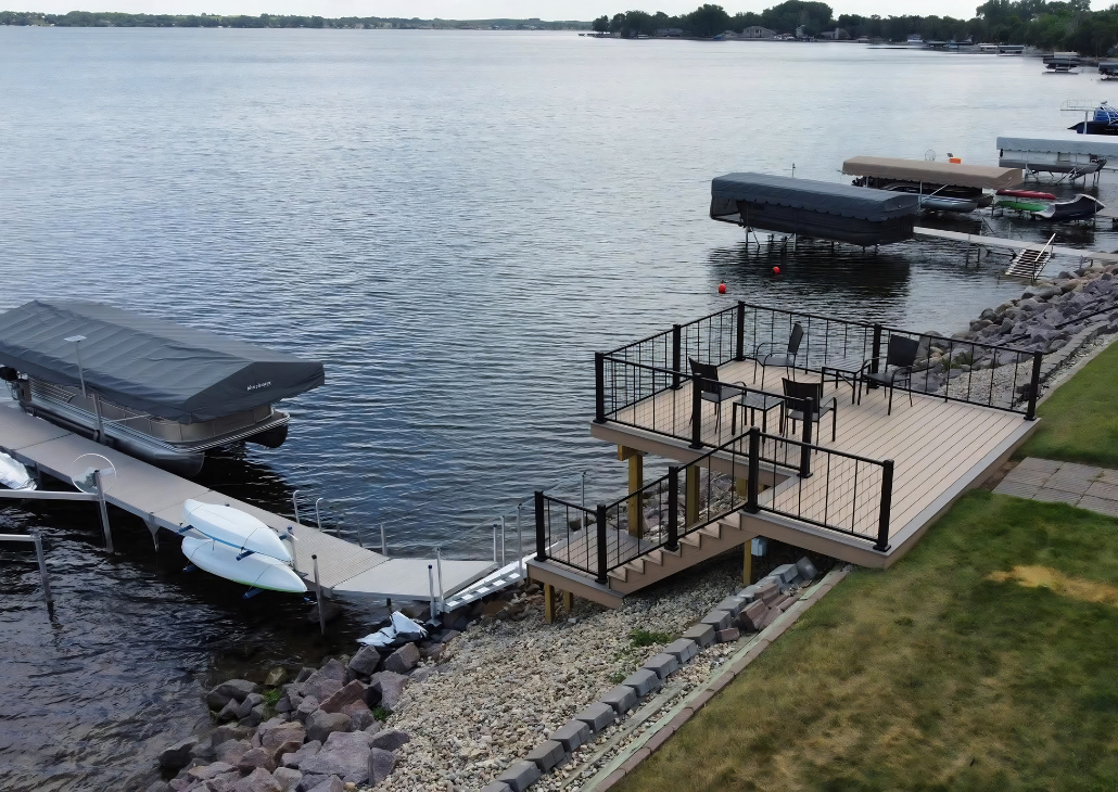 View of the lake and the lower deck.  Kayaks available for guests to use. 