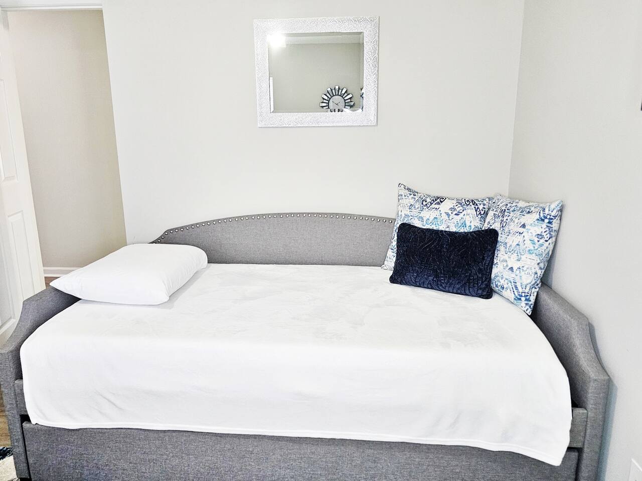 Day bed with a trundle bed underneath. Both beds are twin size. 