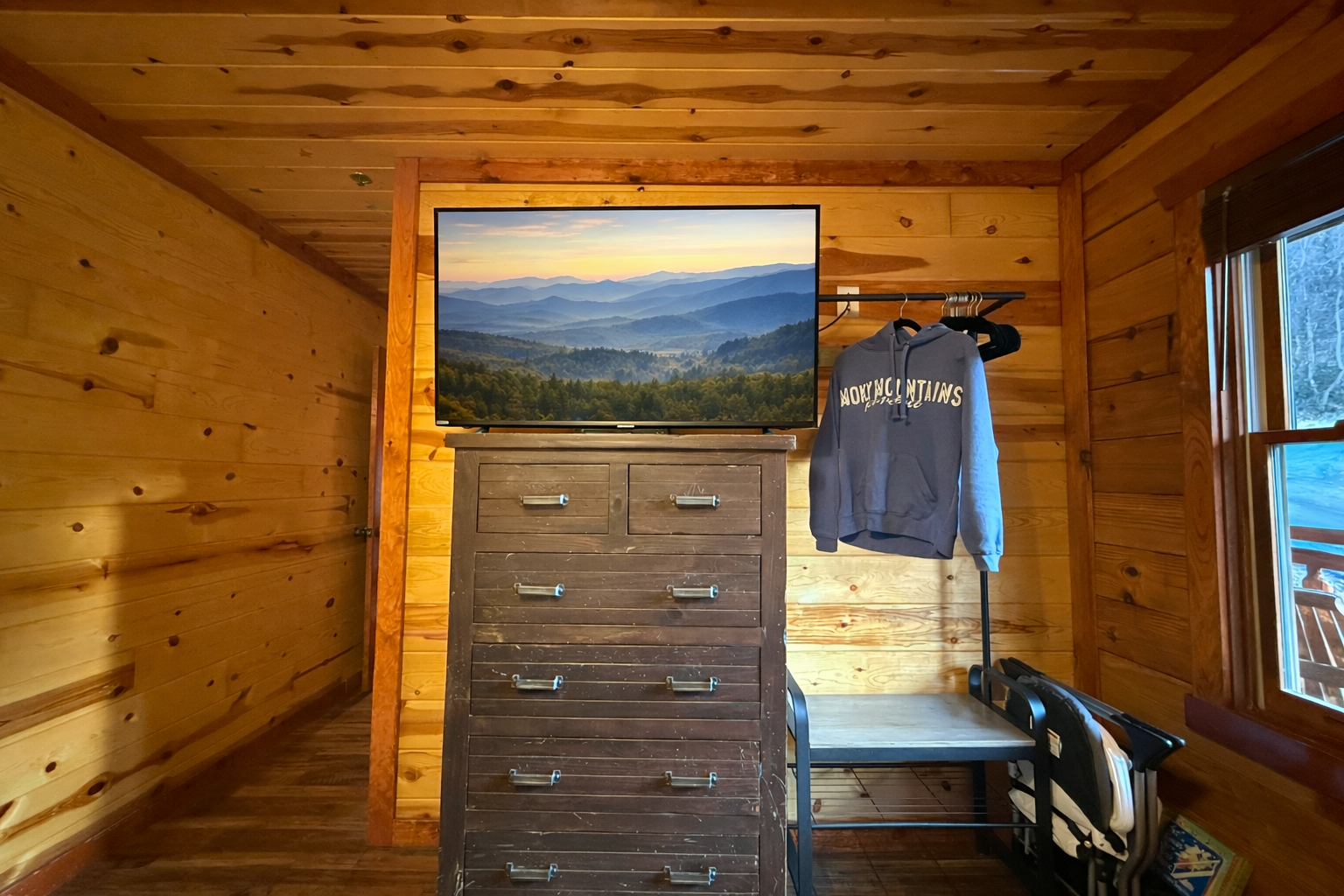 Everything you need to feel at home —ample space for your clothes, plus a TV perfectly placed for relaxing after a day in the Smokies.
