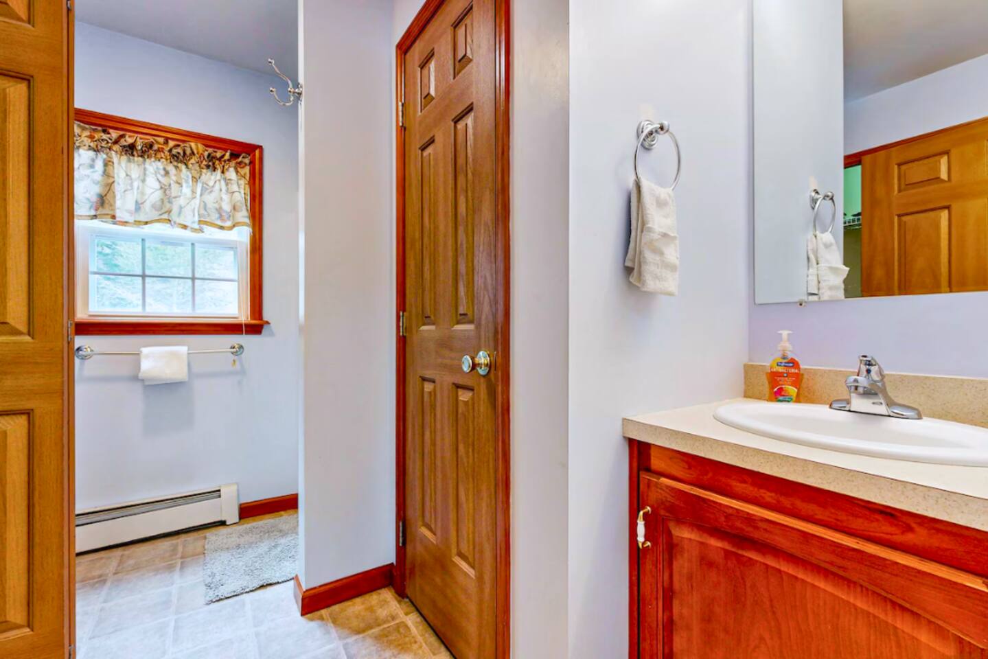 Full bathroom on first floor of the house with stand up shower and Washer/Dryer combo.