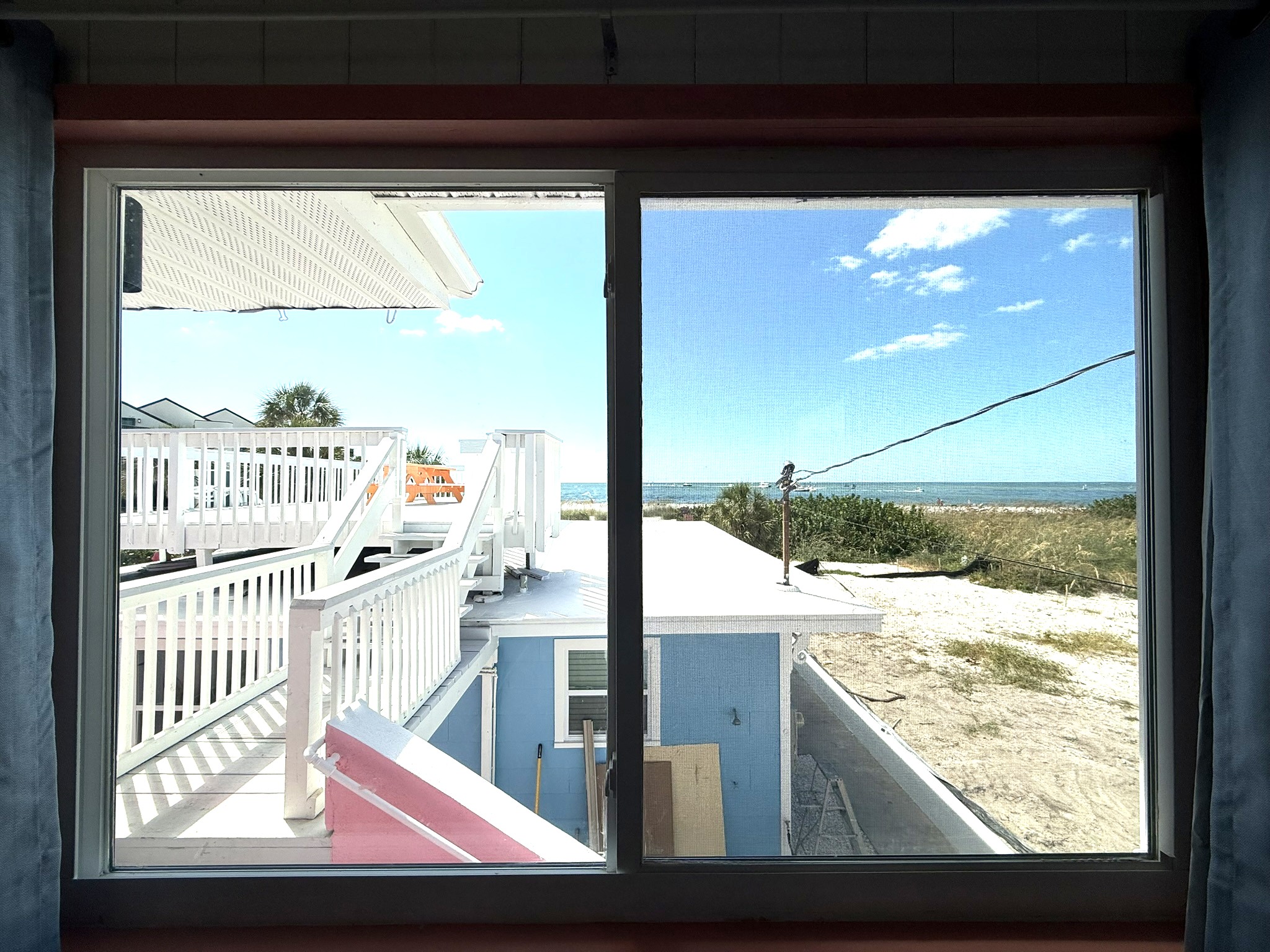 Beach View from Living Room Window & Your Private Rooftop Deck to the Left