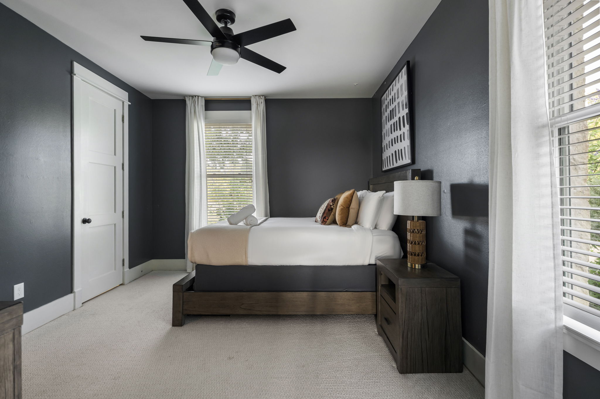 One bedside lamp for night reading and an additional lamp to keep the space well-lit.
