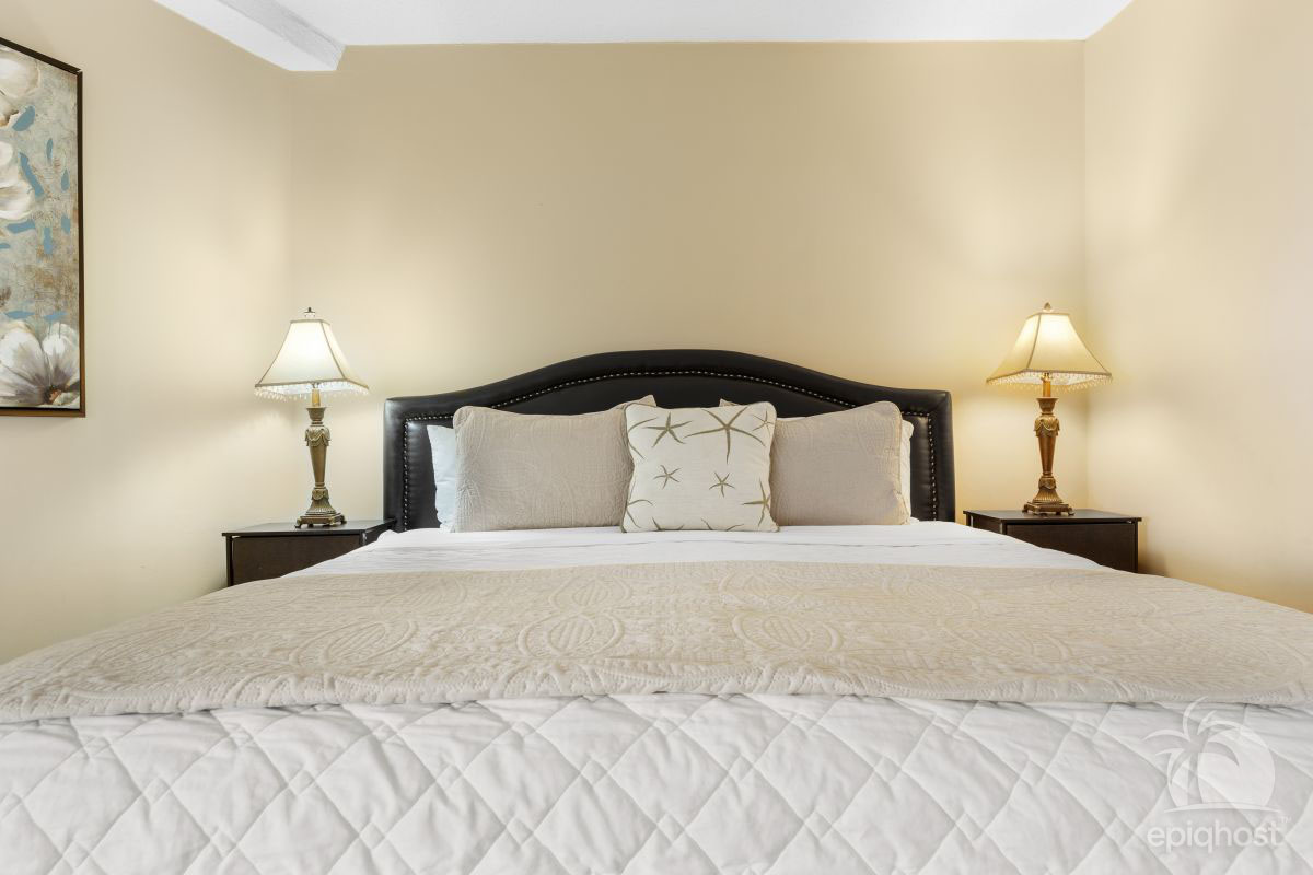 King guest bedroom with HDTV and generous closet space