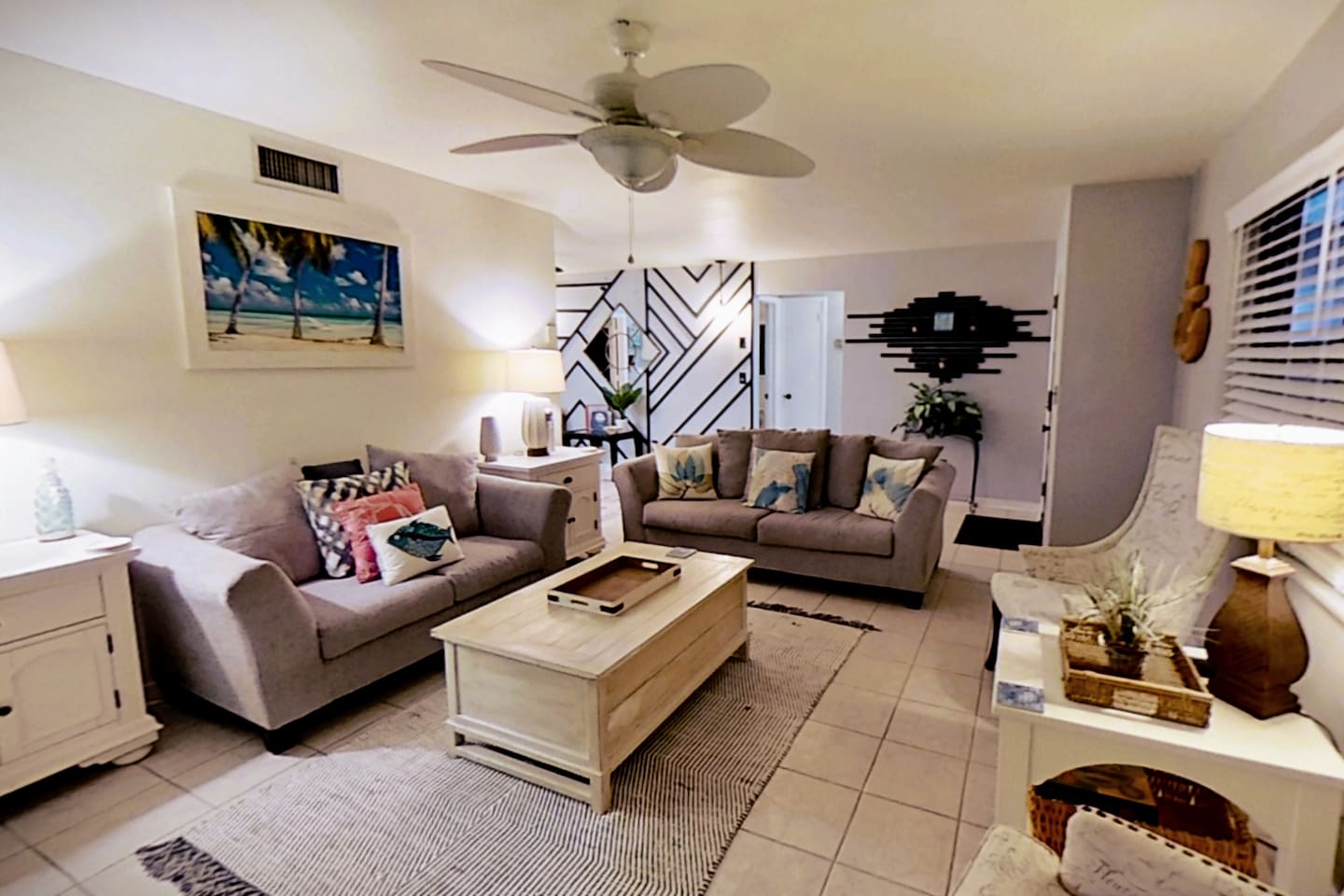 Living Room, clean & comfortable, with plenty of seating to spread out and relax, while enjoying the 65" smart tv
