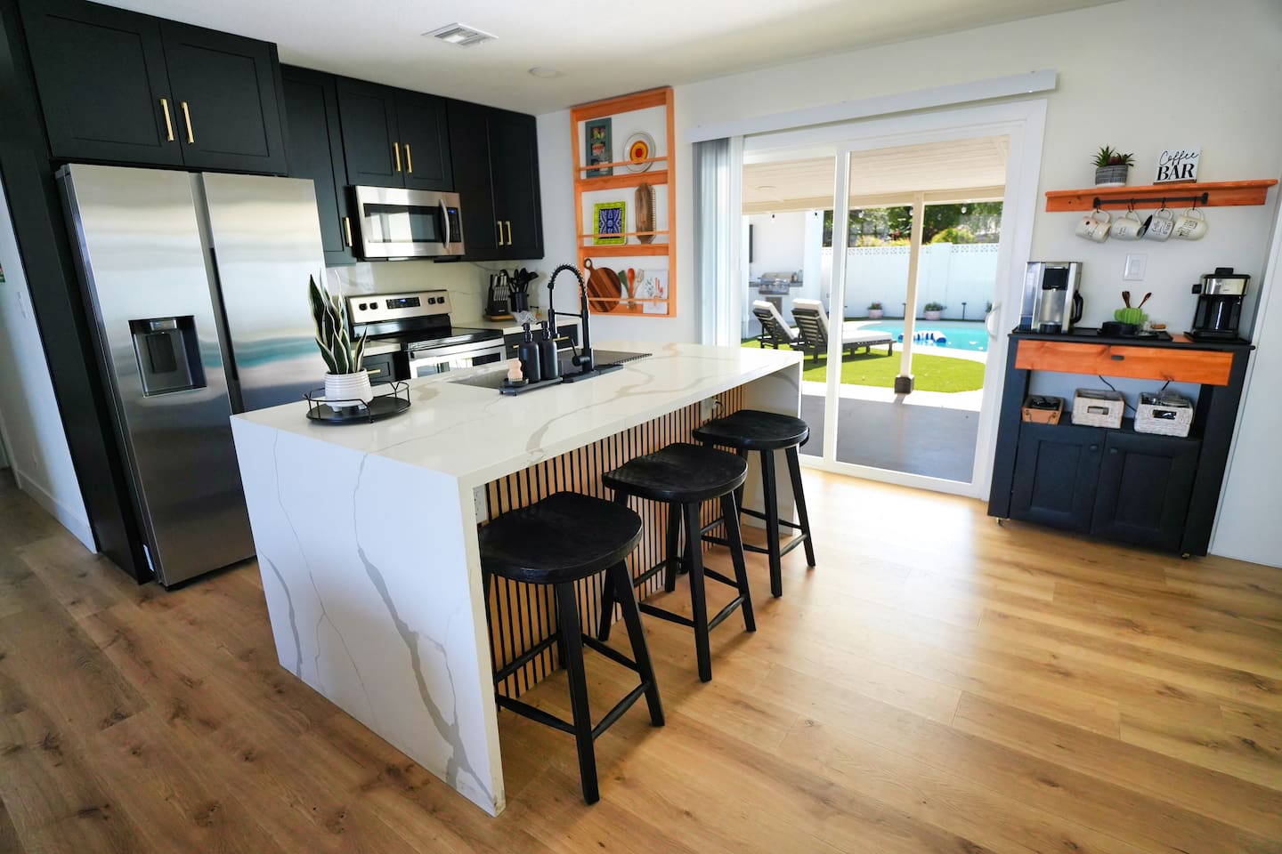 Enjoy a spacious, fully stocked kitchen, ample prep space, and a breakfast bar. Whether you're making a quick snack or a family meal, you'll find everything you need for a comfortable stay.