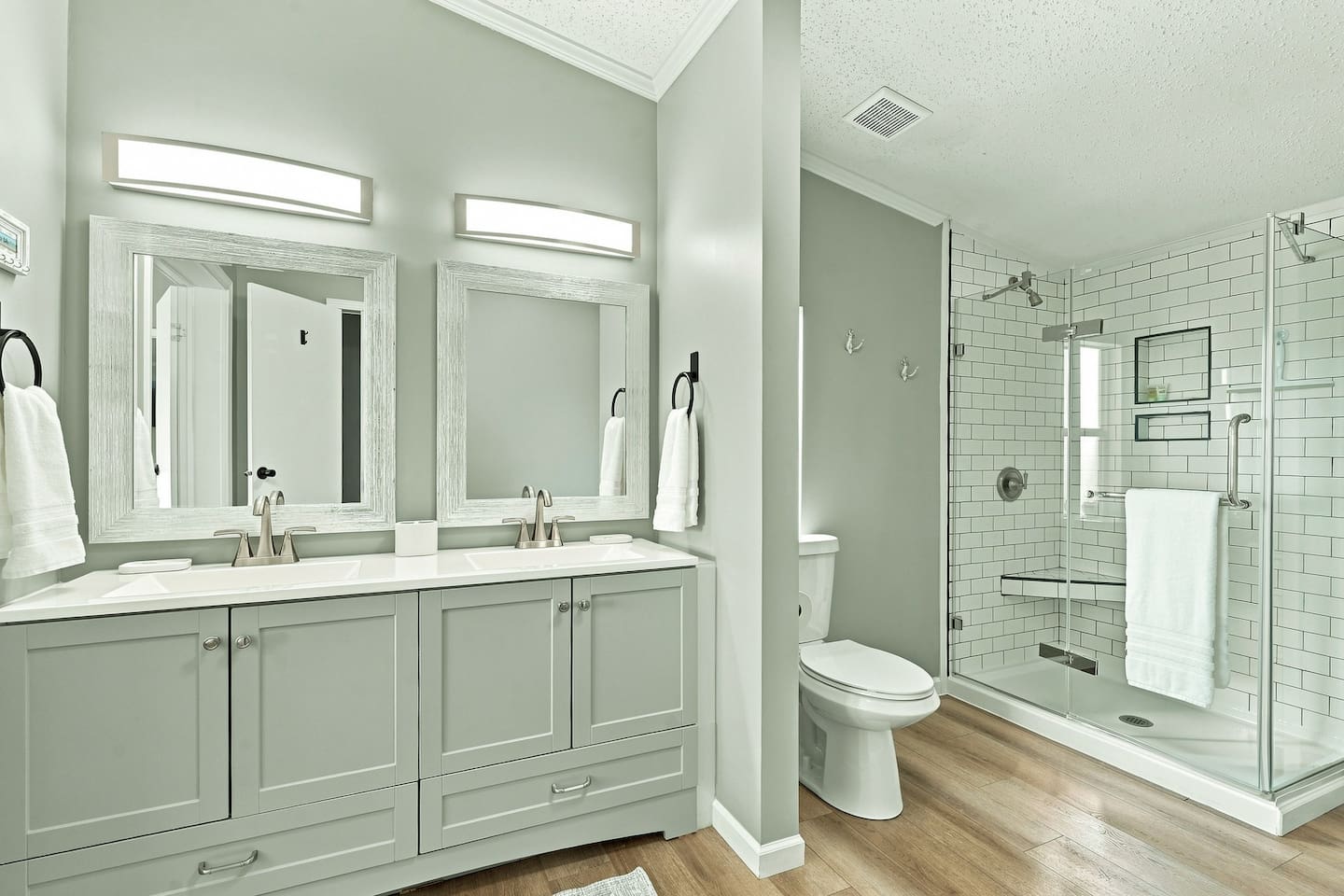 Private ensuite bathroom off the king suite with a spacious vanity and walk-in glass shower, giving you your own comfortable space to get ready.