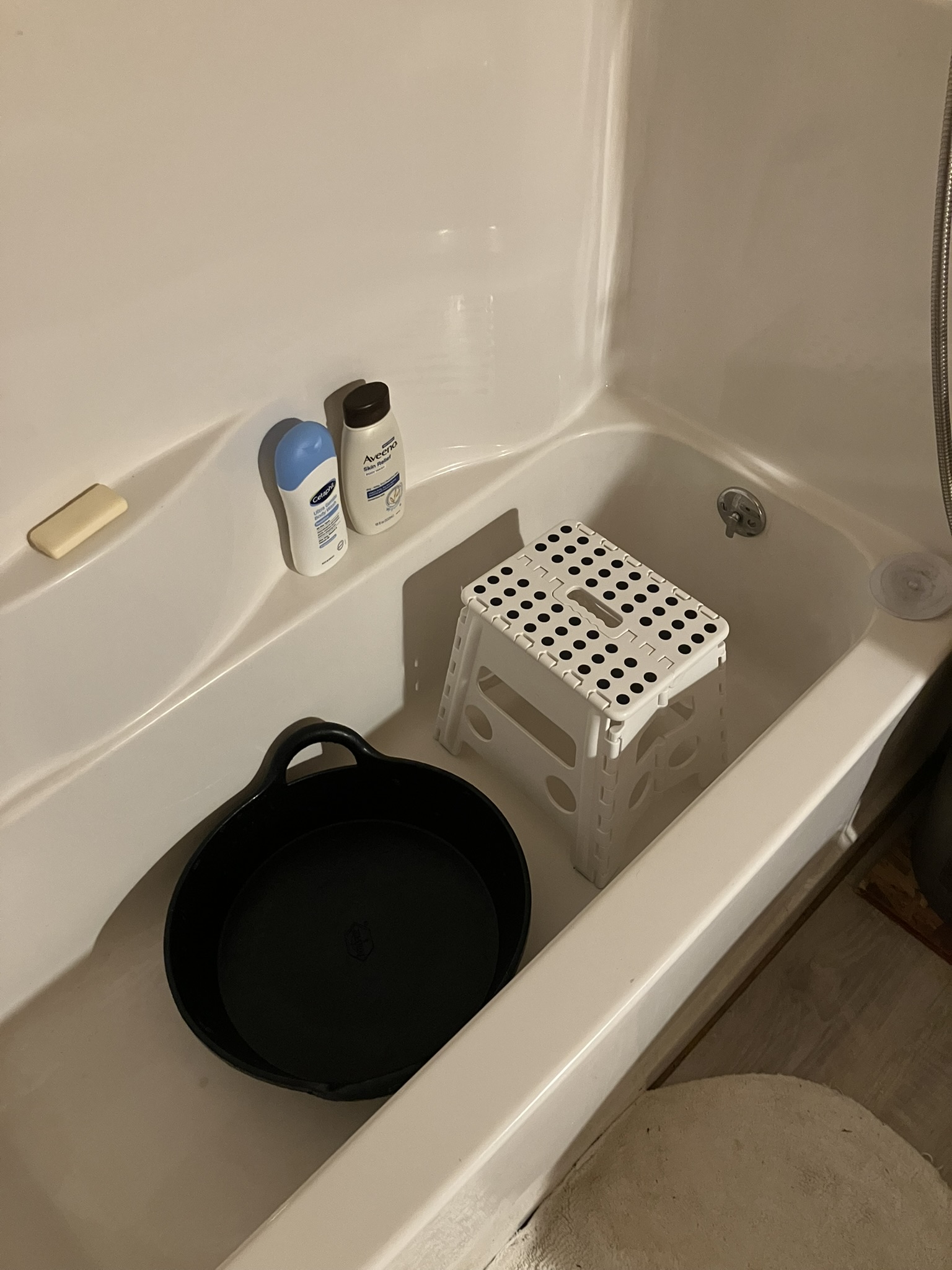 Foot washing station in the tub.