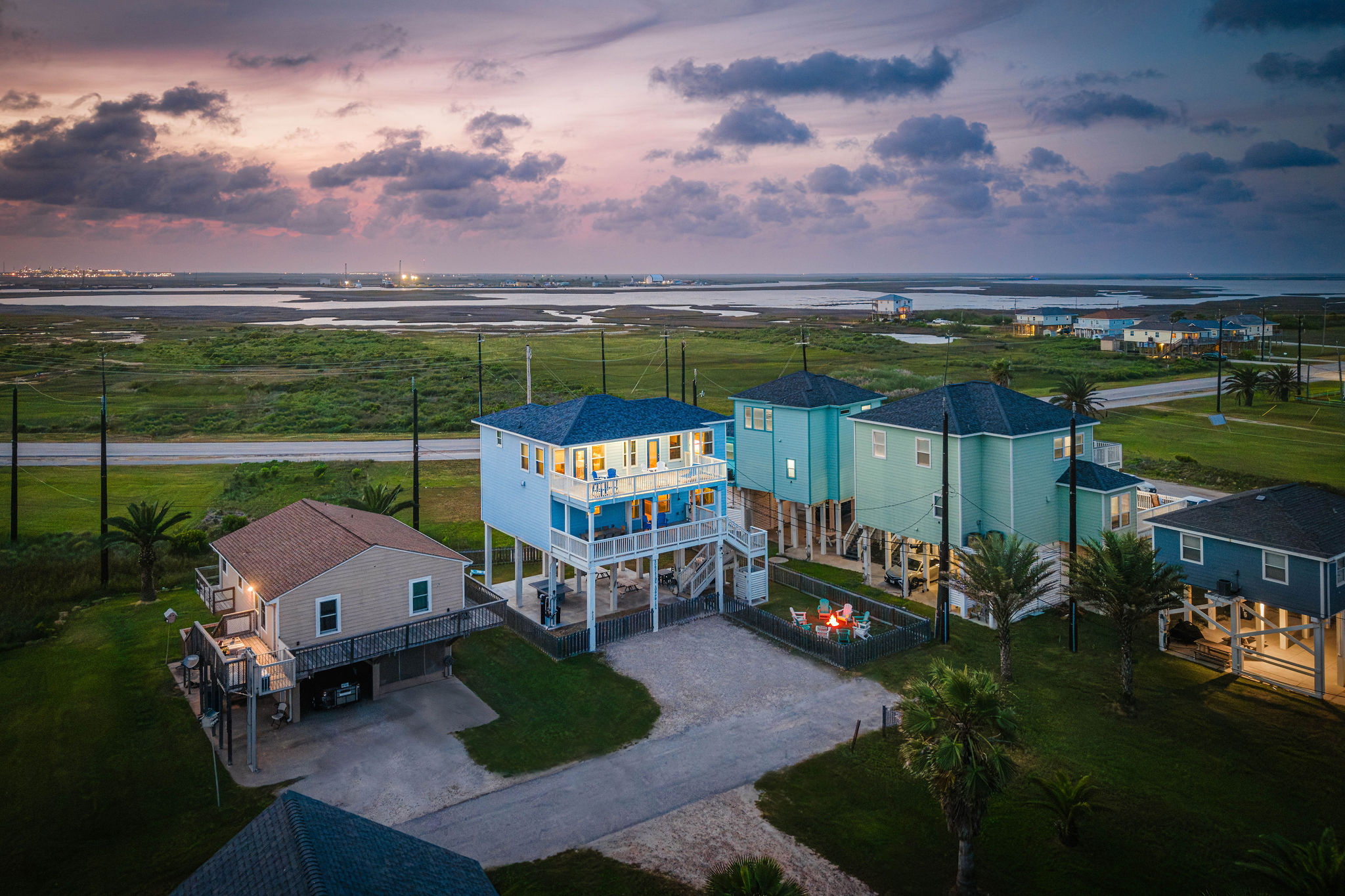 Alt sunset view — the whole exterior glowing against the Gulf sky. This is what every evening looks like.