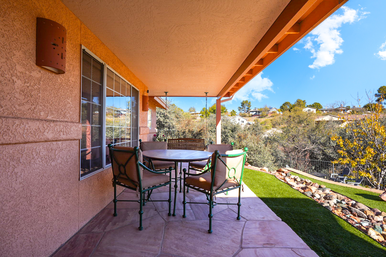 Enjoy meals outdoors under the covered patio—ideal for al fresco dining with peaceful views.