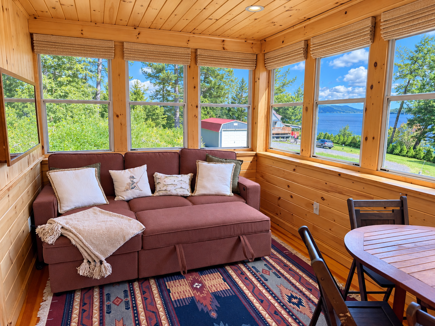 The sofa tuns into a bed providing extra sleeping area on the sun porch.