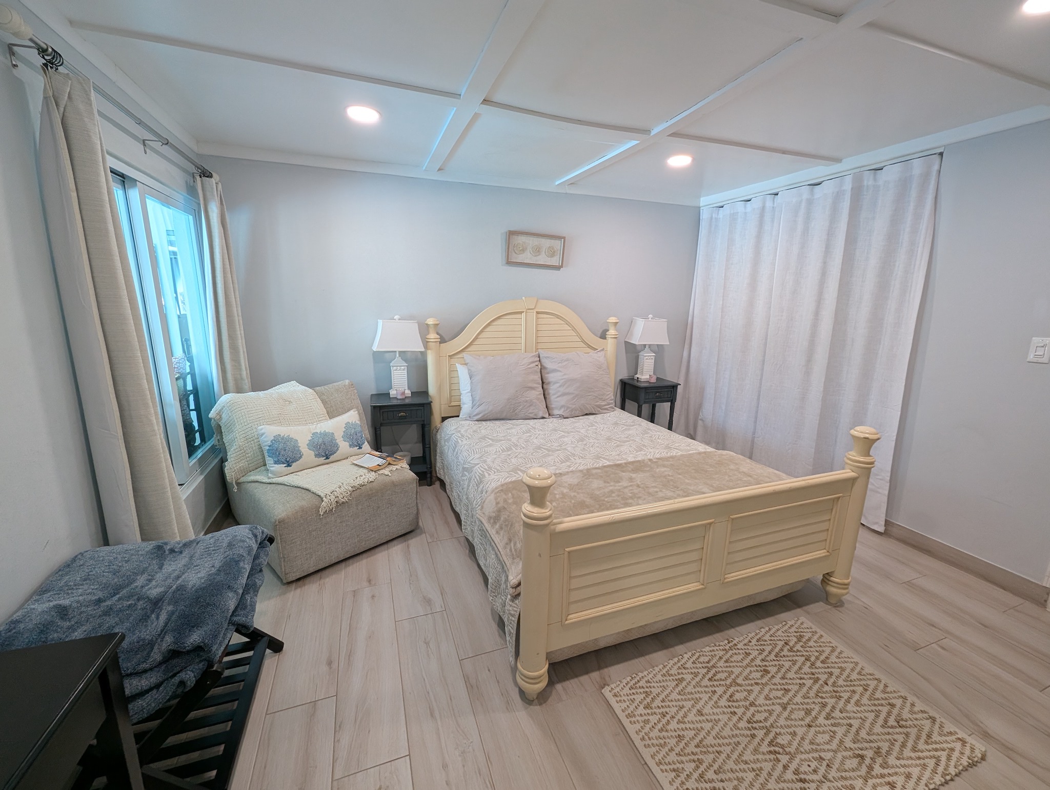 View from the queen guest bedroom bathroom, overlooking the adjustable bed in Dorado, Puerto Rico.