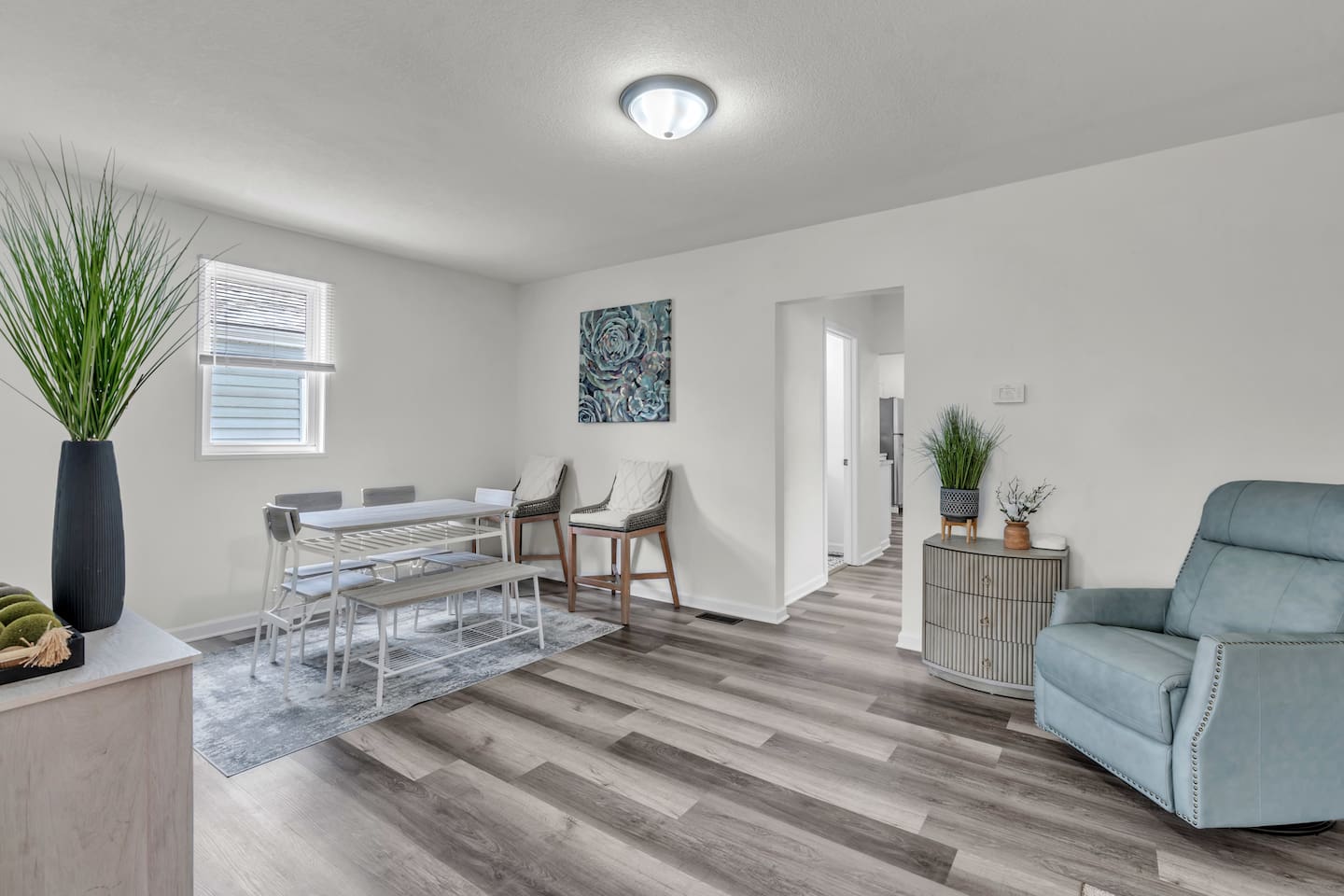 Gather around the dining table in this beautifully designed space, perfect for shared meals and meaningful conversations.