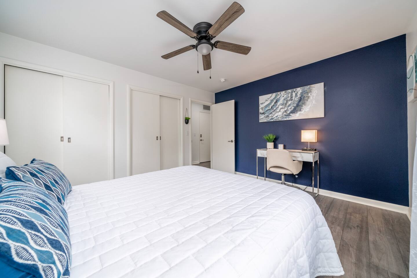 Queen Bedroom with Luxury linens, touch lamps, desk and chair