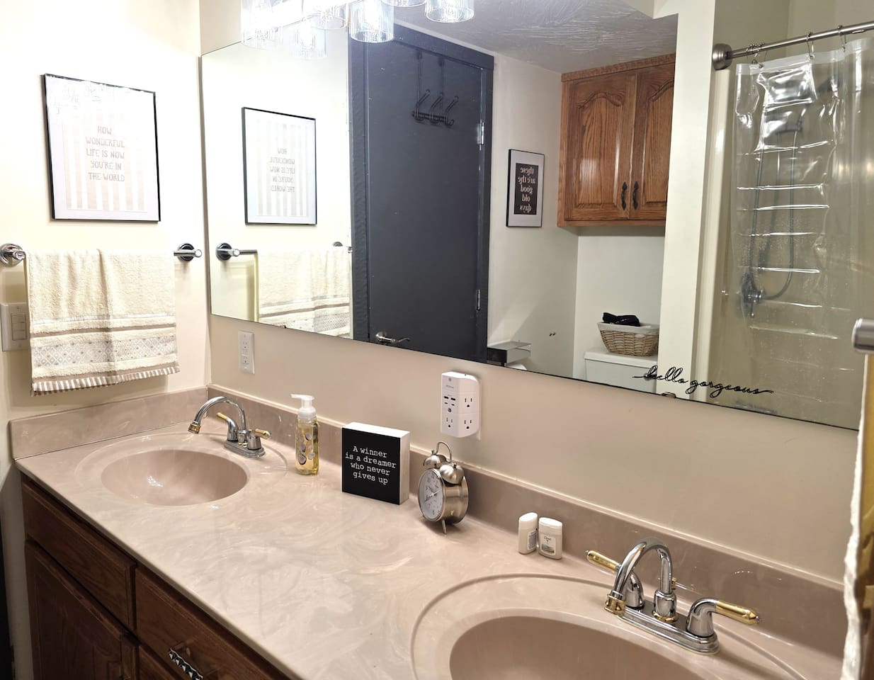 Downstairs bathroom with tub/shower, double sinks and toilet